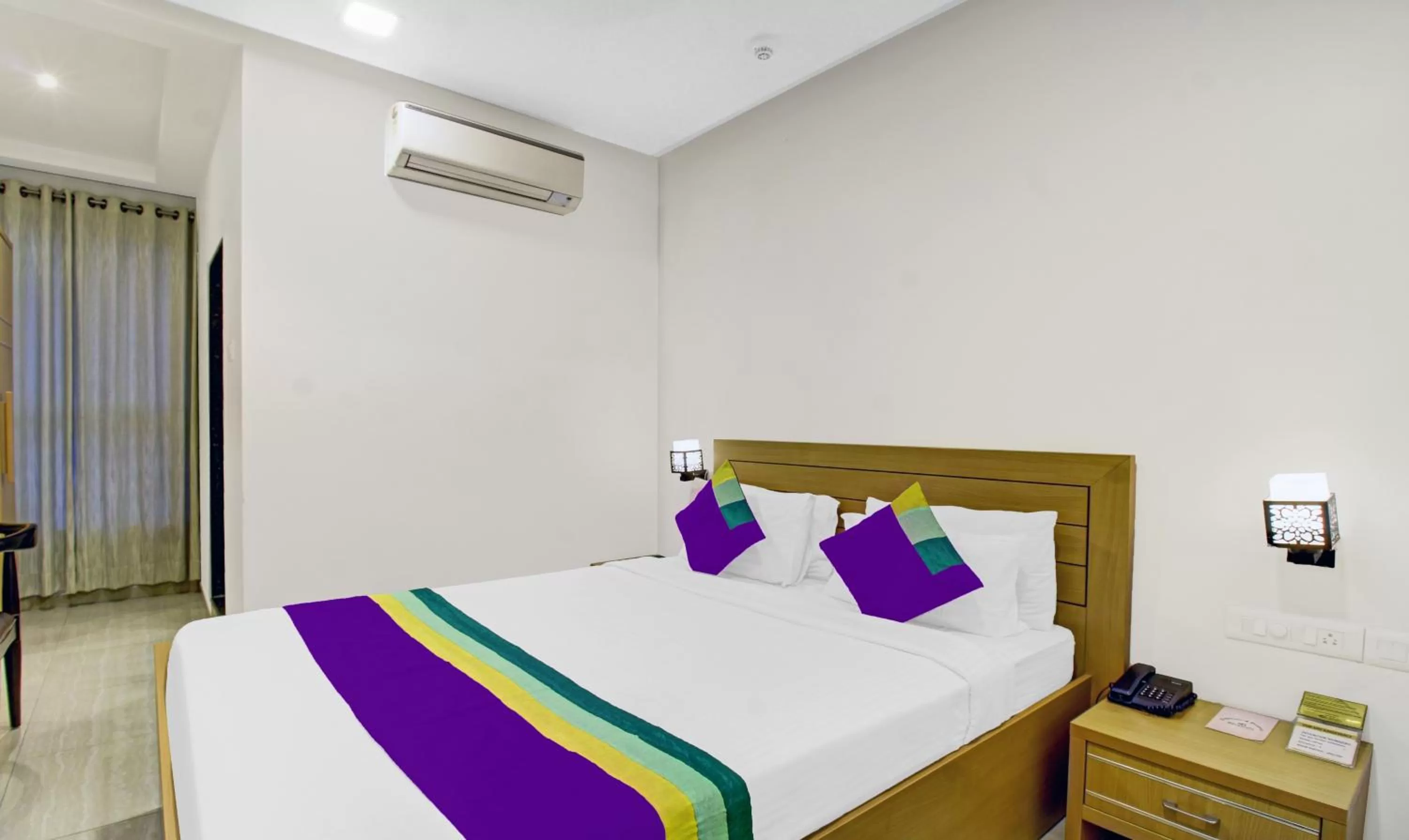 Bedroom, Bed in Treebo Premium Brijinn