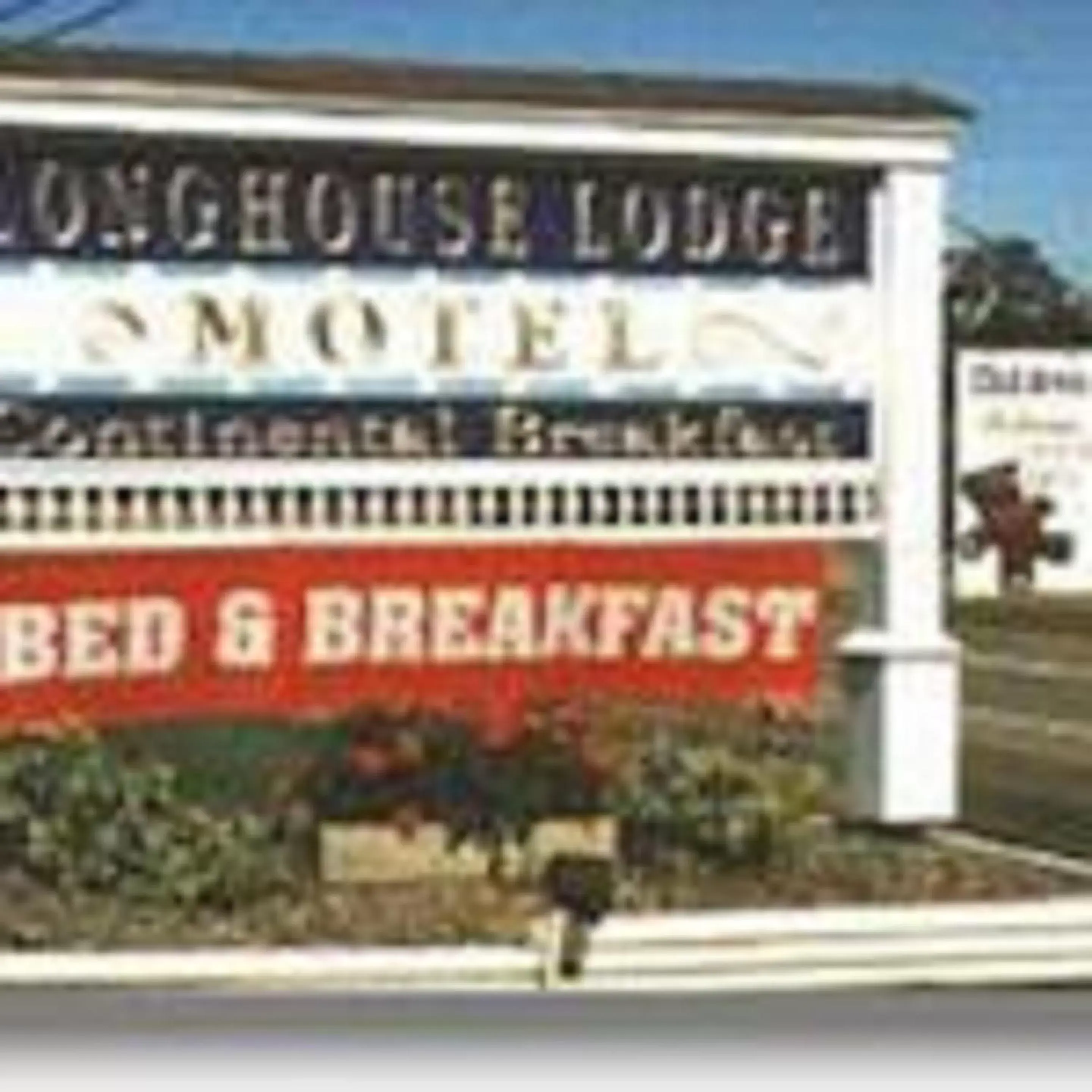 Property logo or sign in Longhouse Lodge Motel