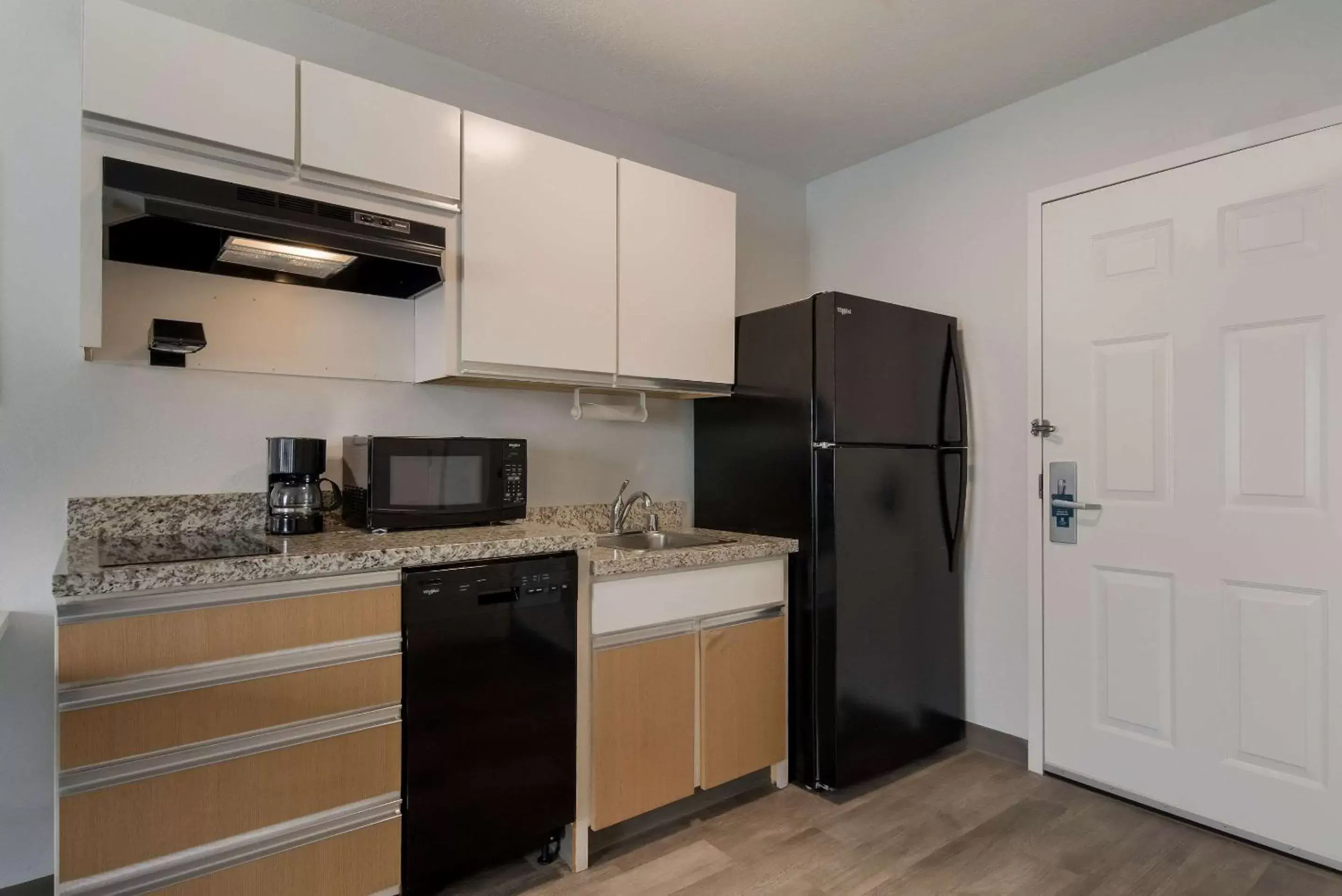 Bedroom, Kitchen/Kitchenette in MainStay Suites Denver Tech Center