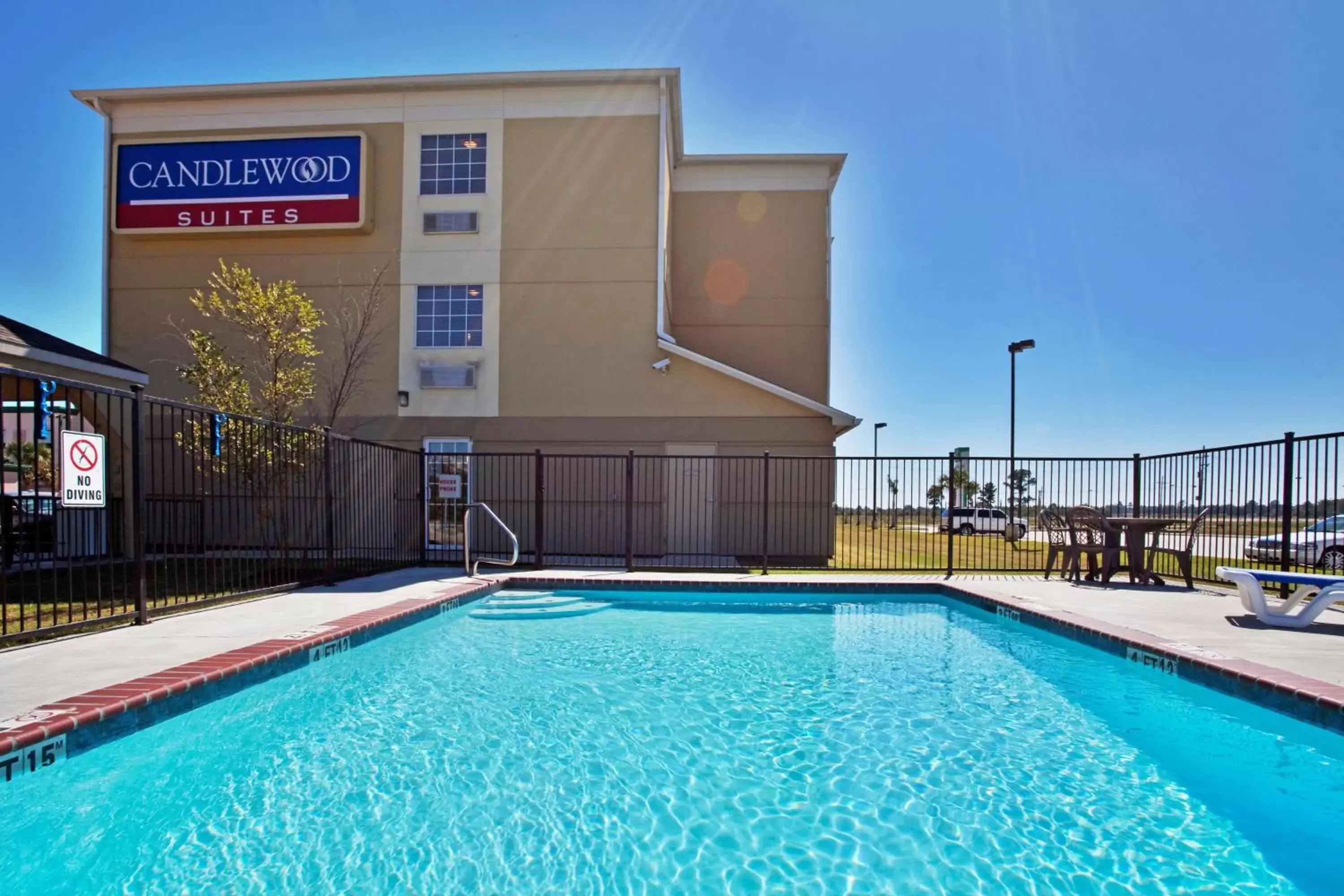 Swimming pool, Property Building in Candlewood Suites Lake Charles-Sulphur, an IHG Hotel