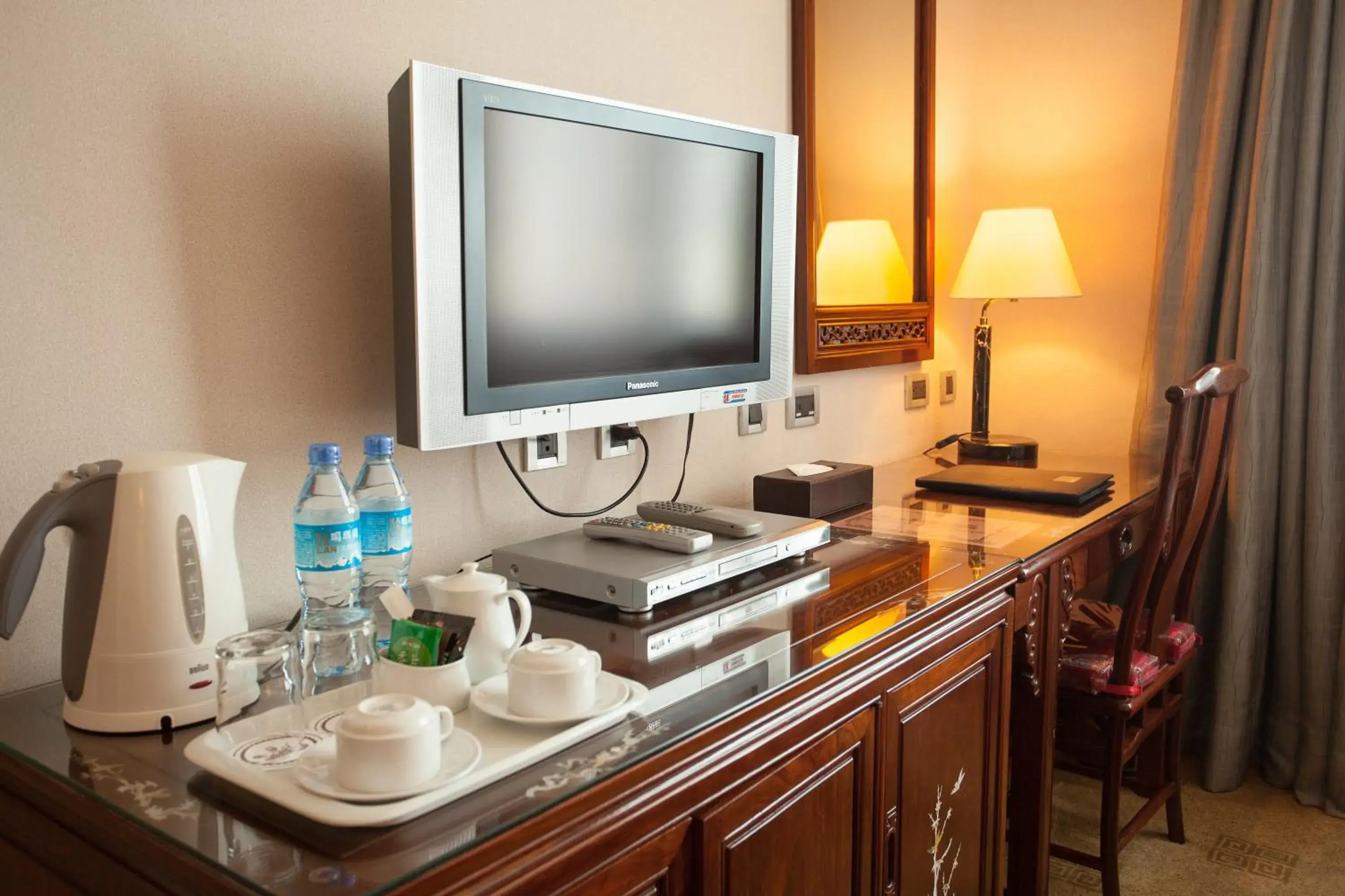 Photo of the whole room, TV/Entertainment Center in Rich Garden Hotel