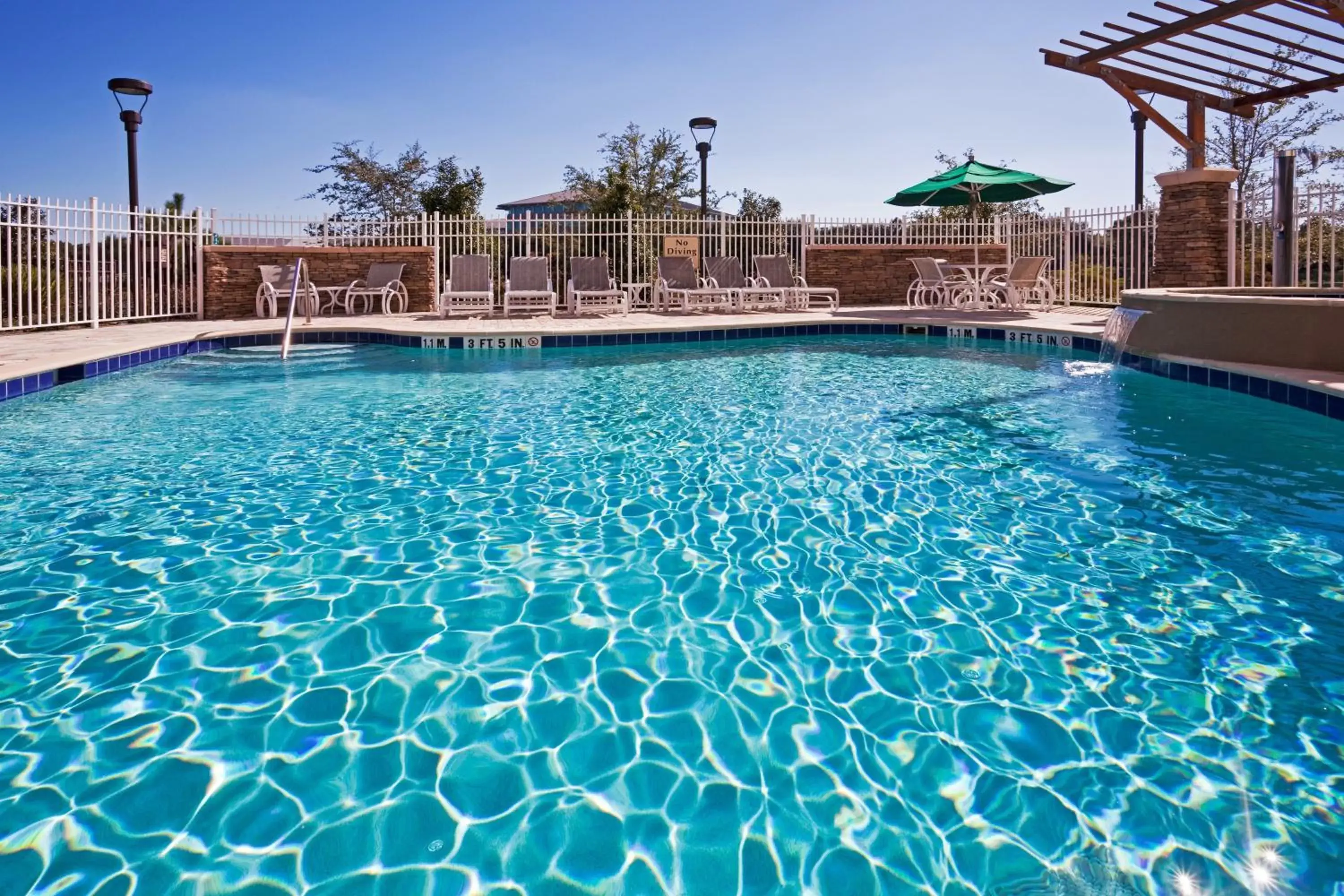 Swimming Pool in Hotel Indigo Jacksonville-Deerwood Park, an IHG Hotel