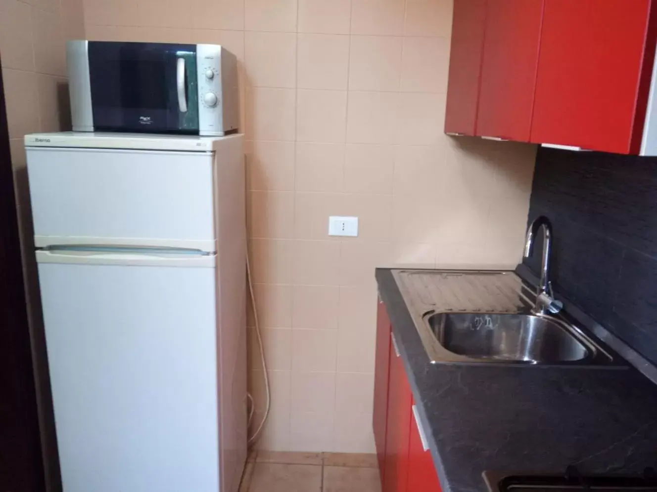 Kitchen/Kitchenette in Stanza in Villa con giardino vista mare