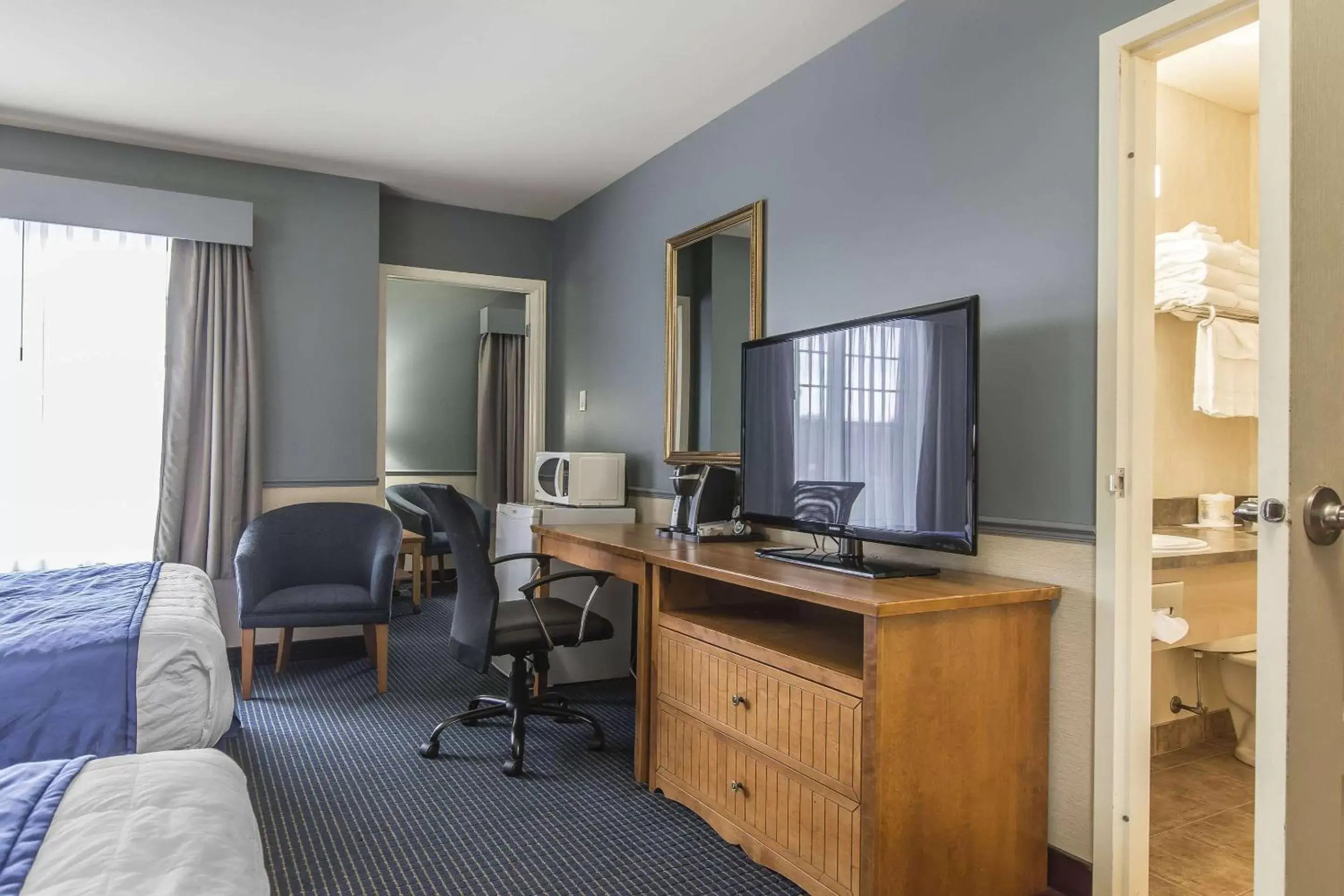 Photo of the whole room, TV/Entertainment Center in Quality Inn Riviere-Du-Loup