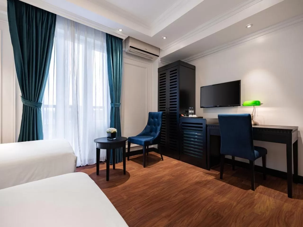 Bed in The Flower Boutique Hotel & Travel