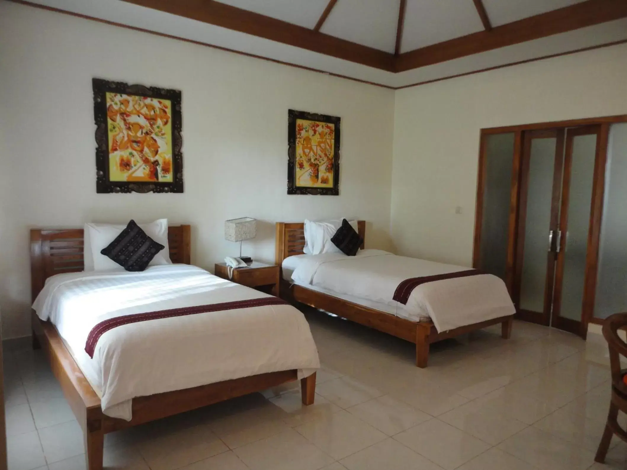 Bed in Puri Sari Beach Hotel