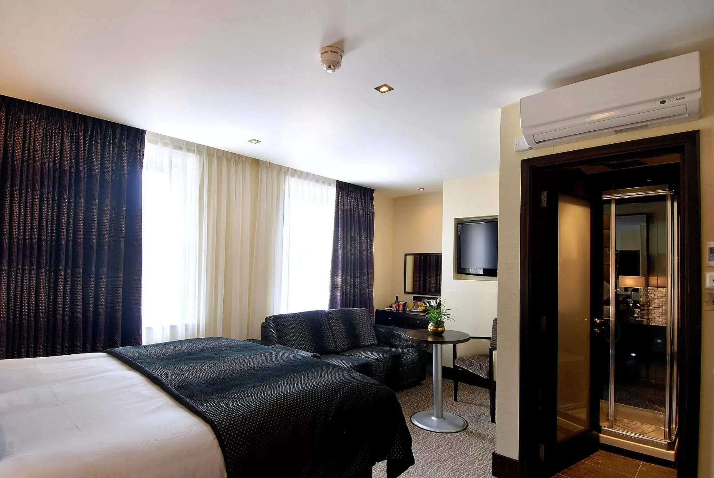 Bedroom in The Marble Arch Suites