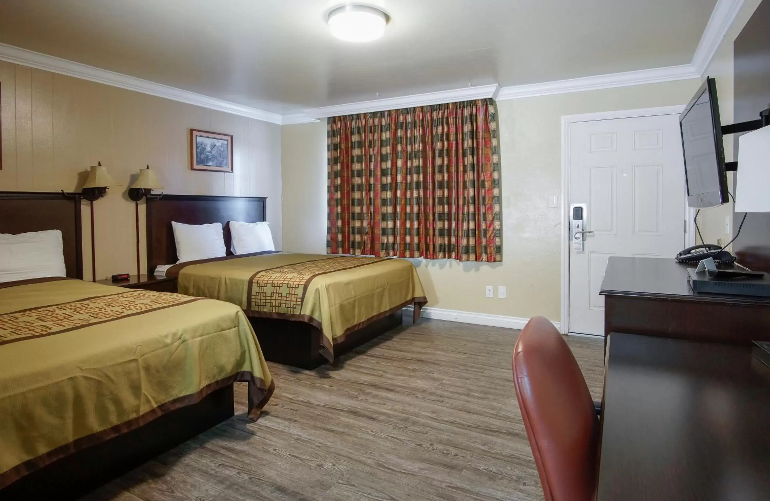 Photo of the whole room in Charm Motel & Suites