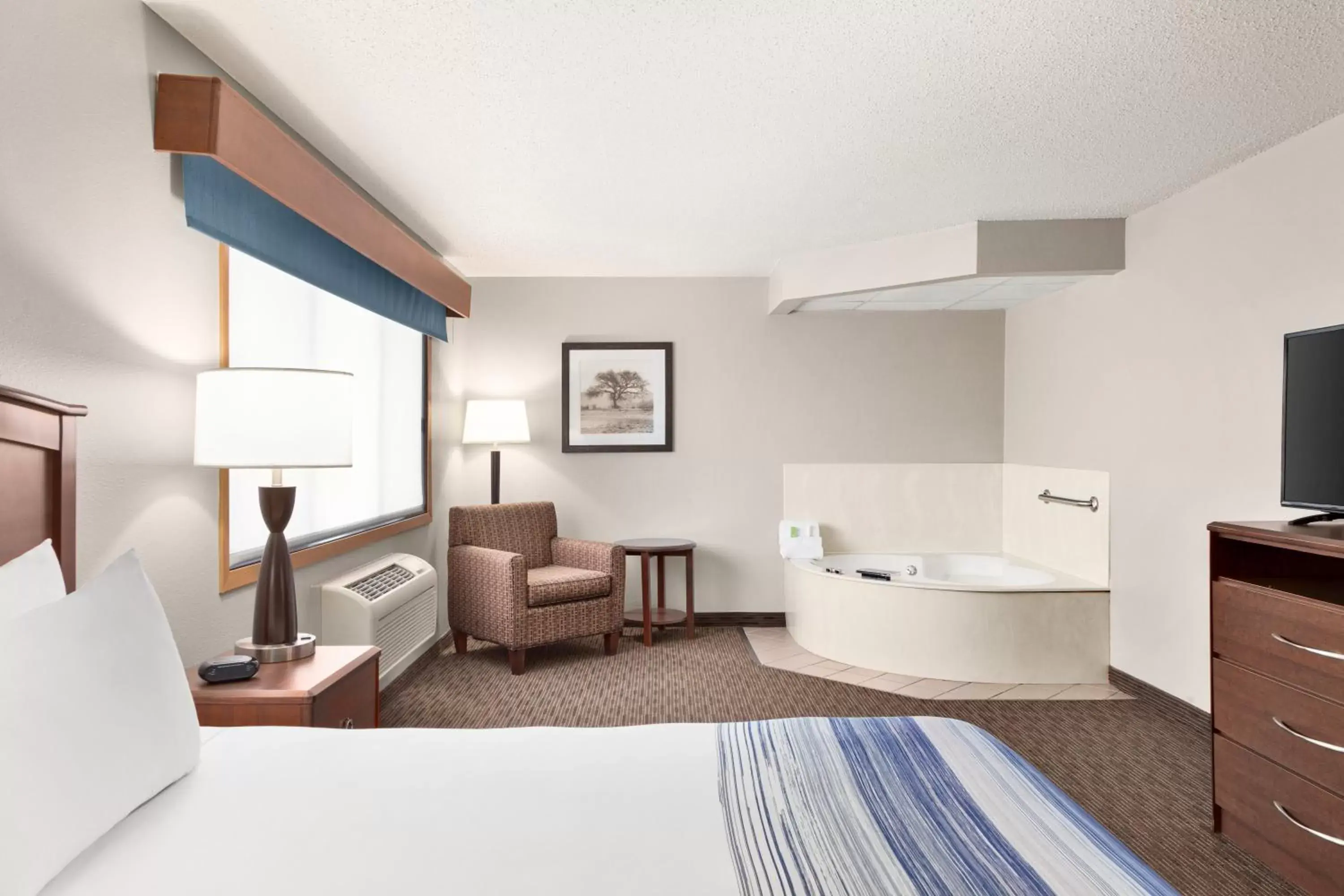 Premier King Suite - Non-Smoking in AmericInn by Wyndham Sauk Centre