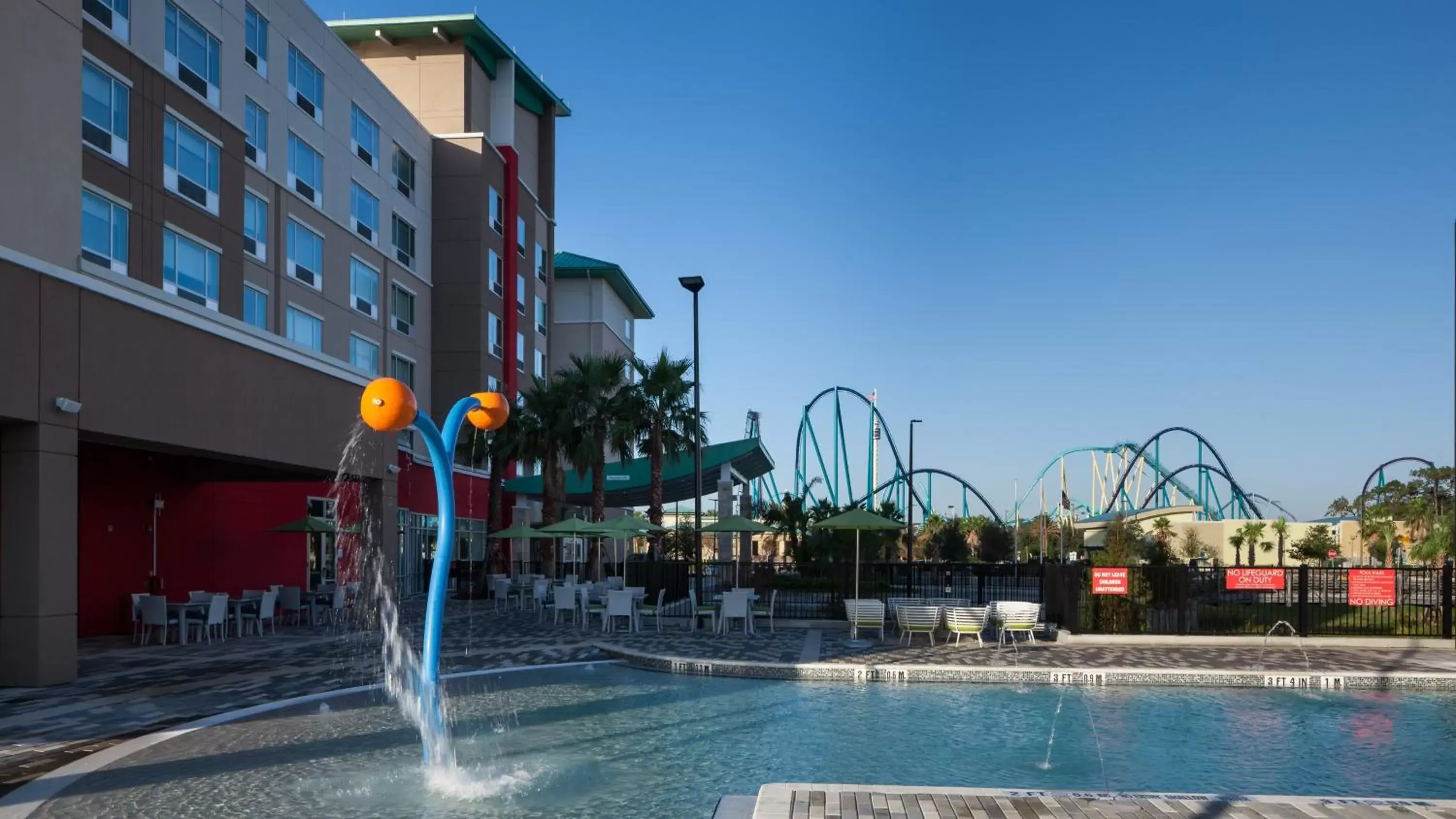 Property building, Swimming Pool in Holiday Inn Express & Suites - Orlando At Seaworld, an IHG Hotel