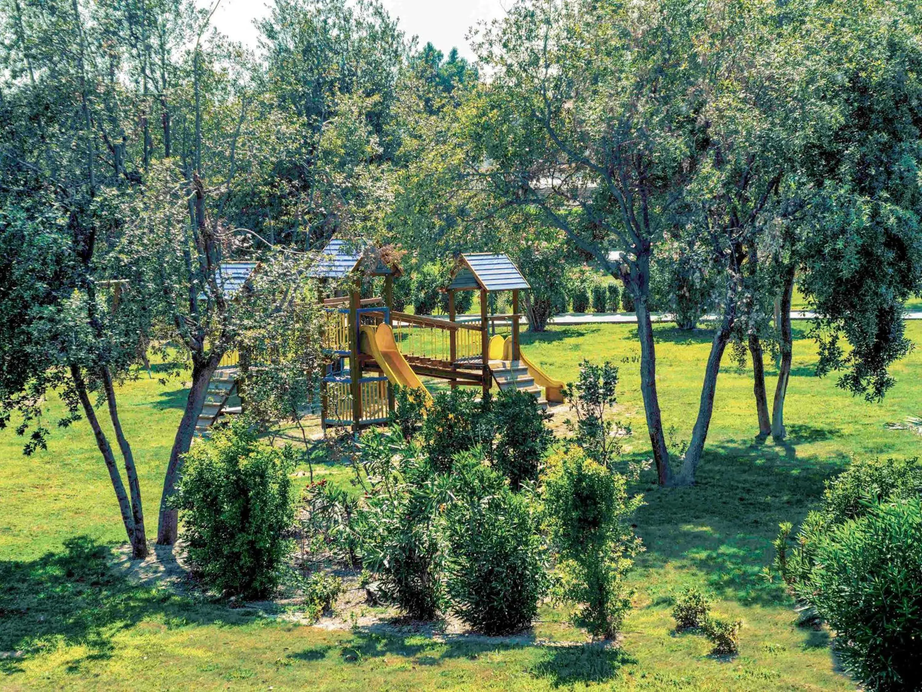 Property building, Children's Play Area in TH Tirrenia - Green Park Resort