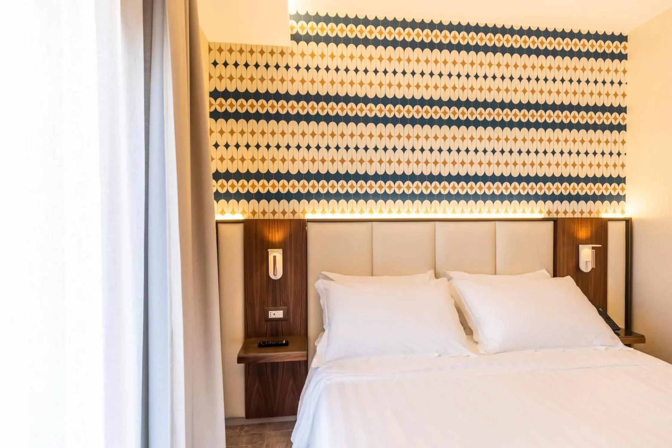 Bed in Solmaris Tropea Rooms & Suites