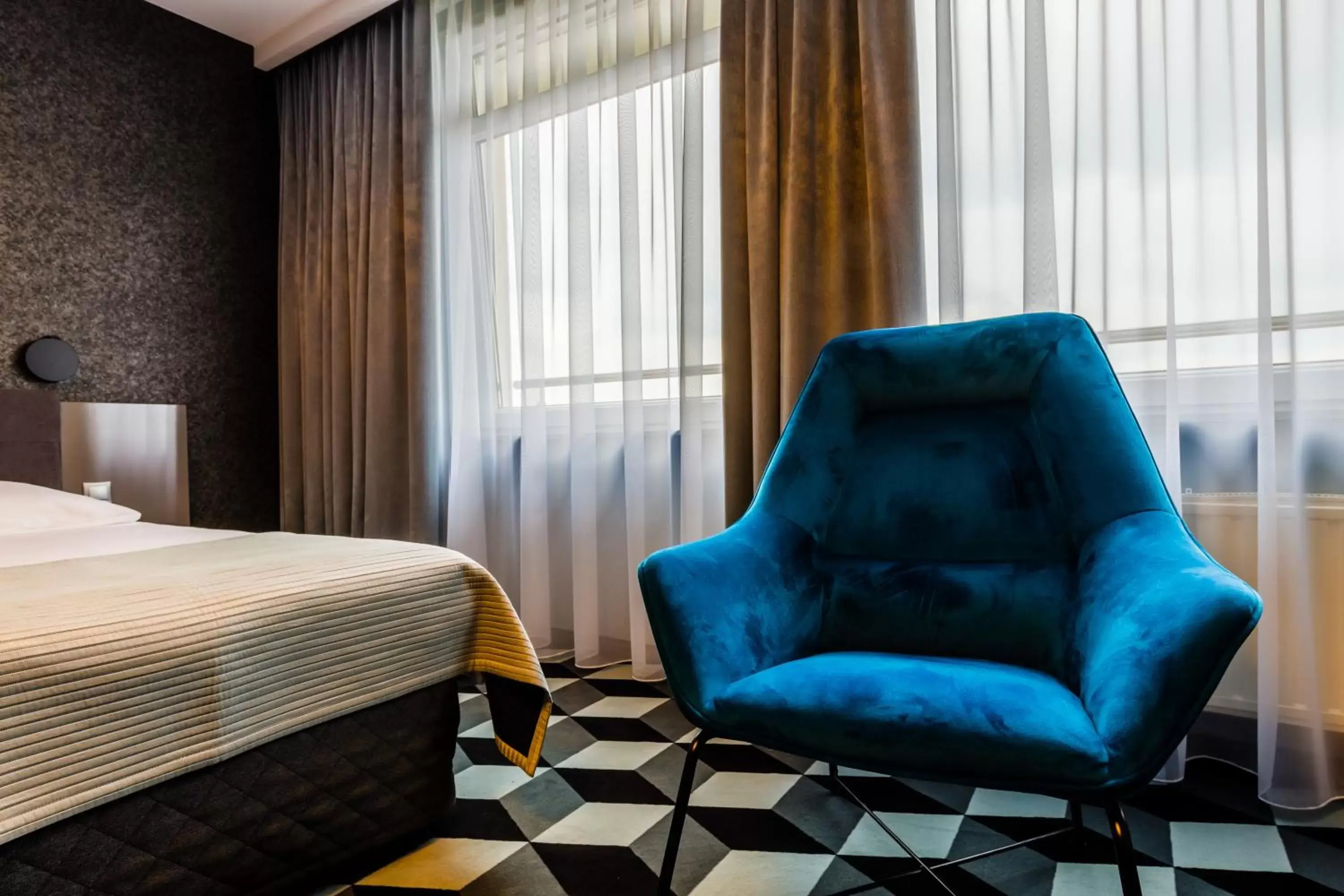 Seating area, Bed in Hotel Wyspiański Seating area, Bed in Hotel Wyspiański