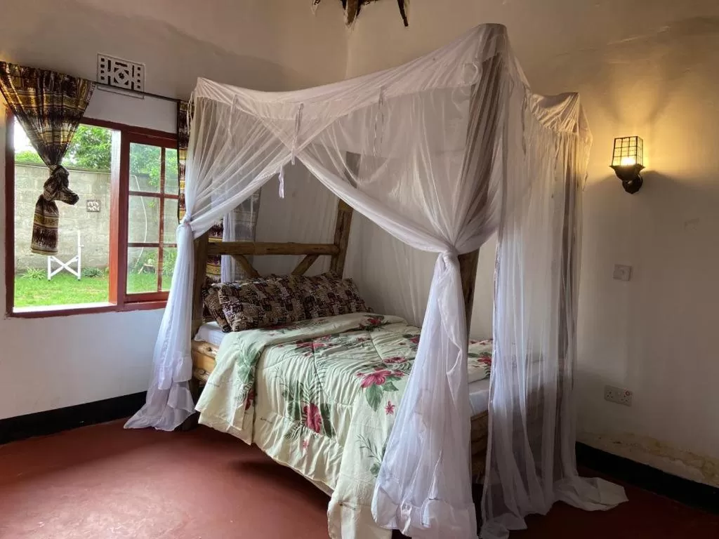 Bed in Charming Eco-Homestay near Kilimanjaro International Airport