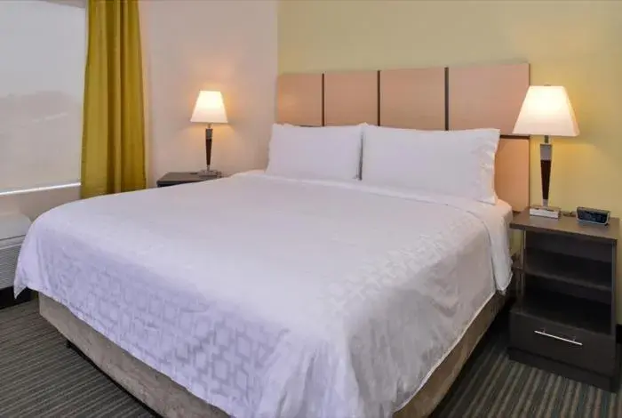 Bed in Candlewood Suites - Austin Airport, an IHG Hotel