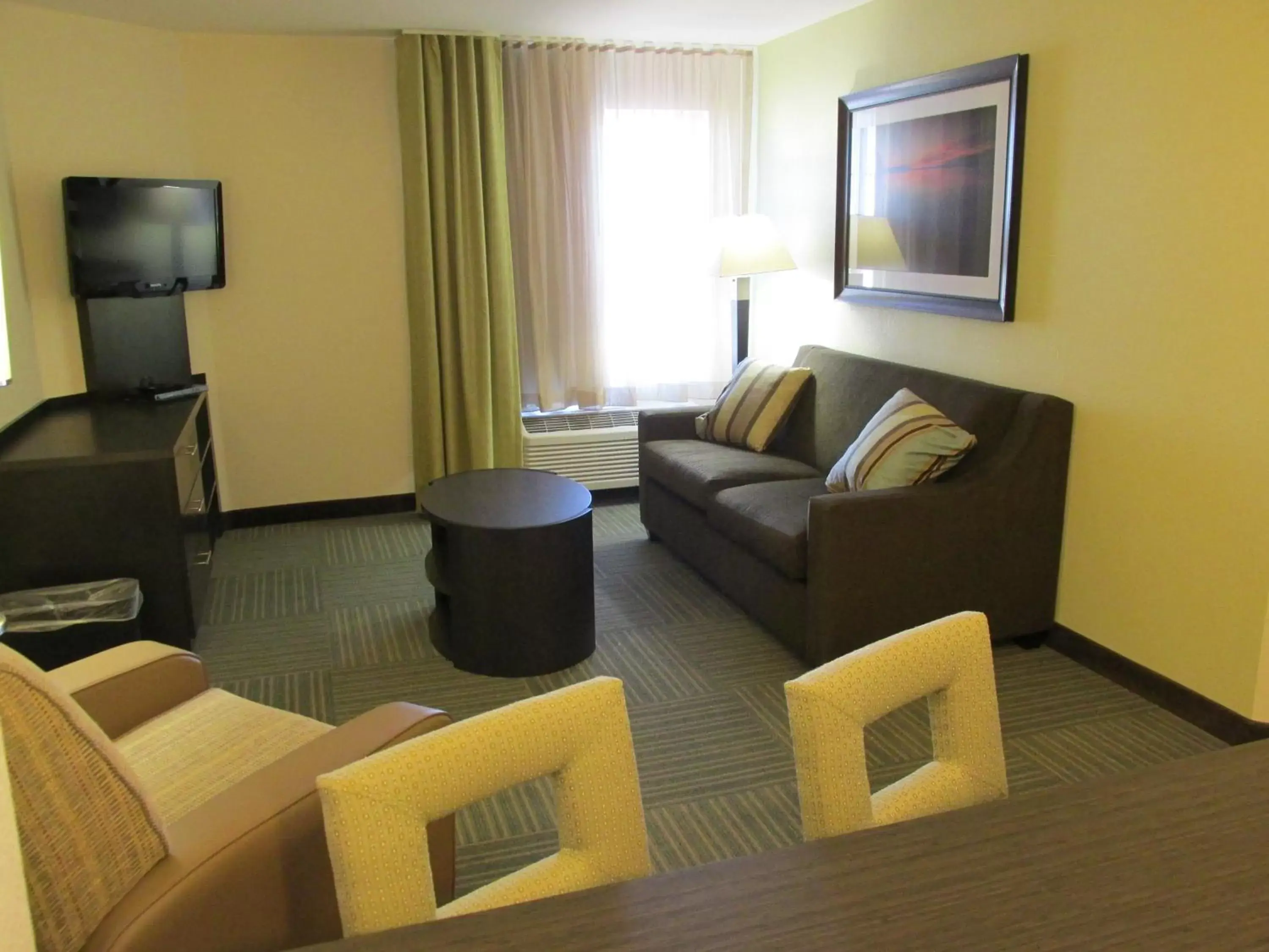 Photo of the whole room, Seating Area in Candlewood Suites Greenville, an IHG Hotel