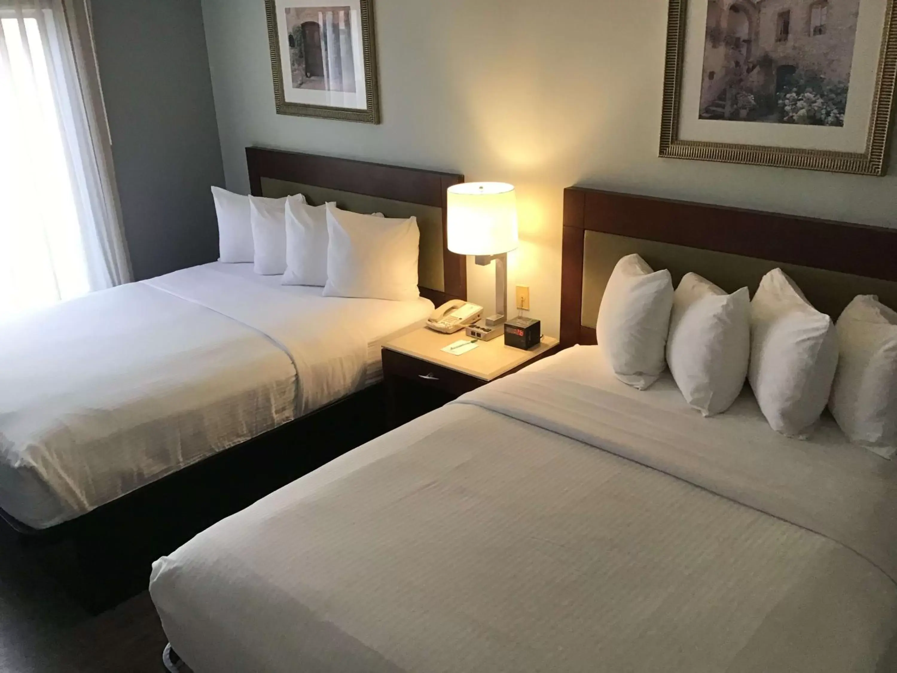 Bed in SureStay Studio by Best Western Pensacola