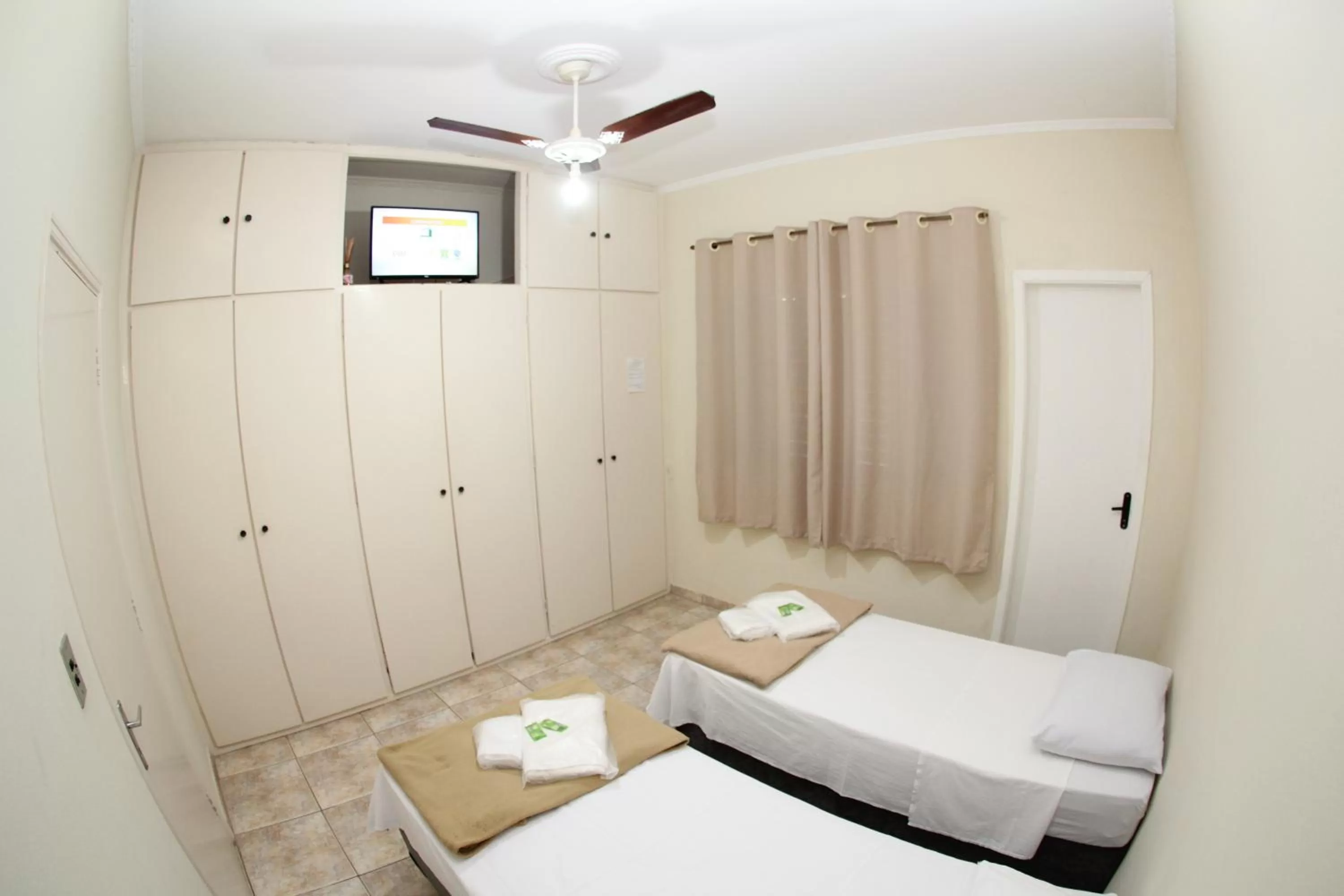 Bed in Pousada Santa Genebra