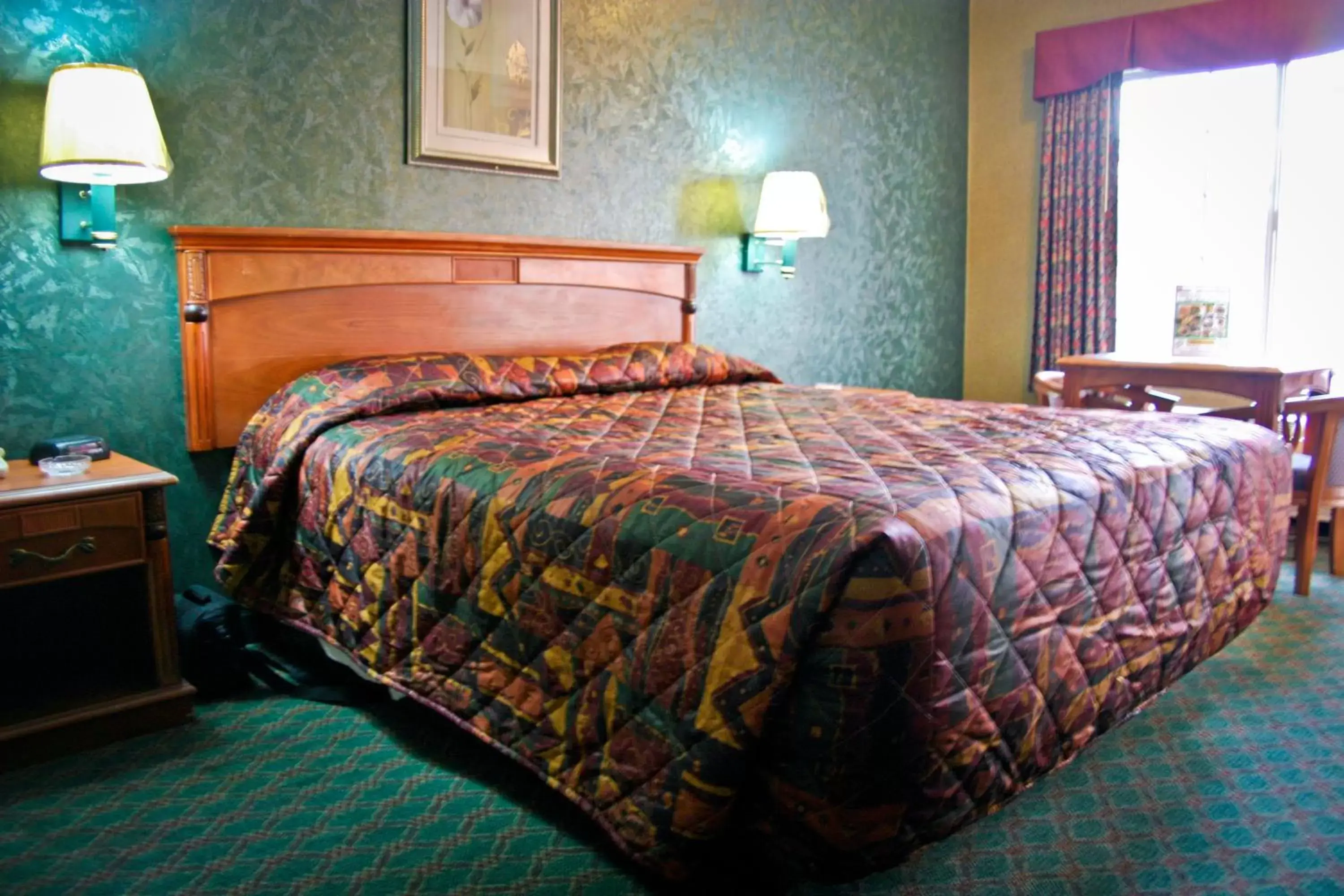 Bed in Crystal Inn Suites & Spas