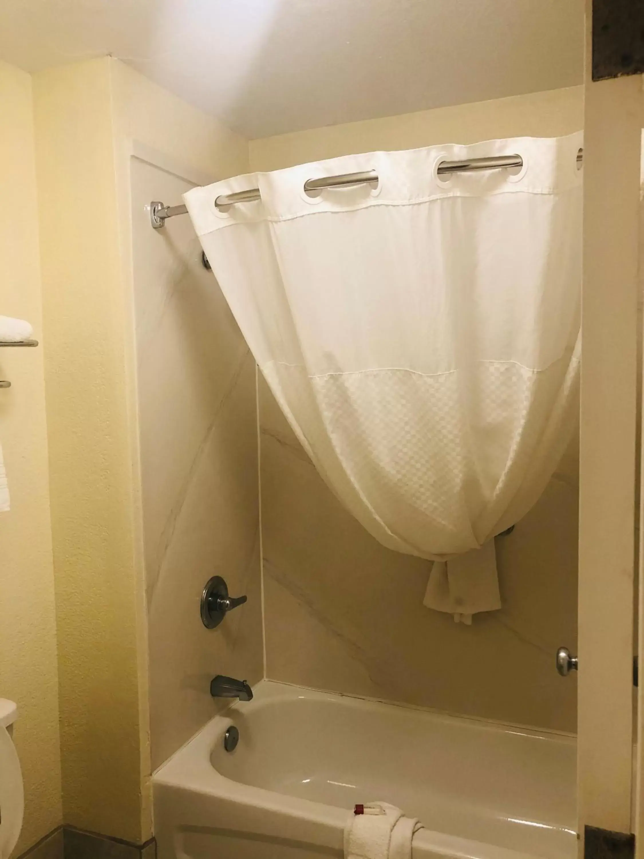 Bathroom in Days Inn & Suites by Wyndham Navarre Conference Center
