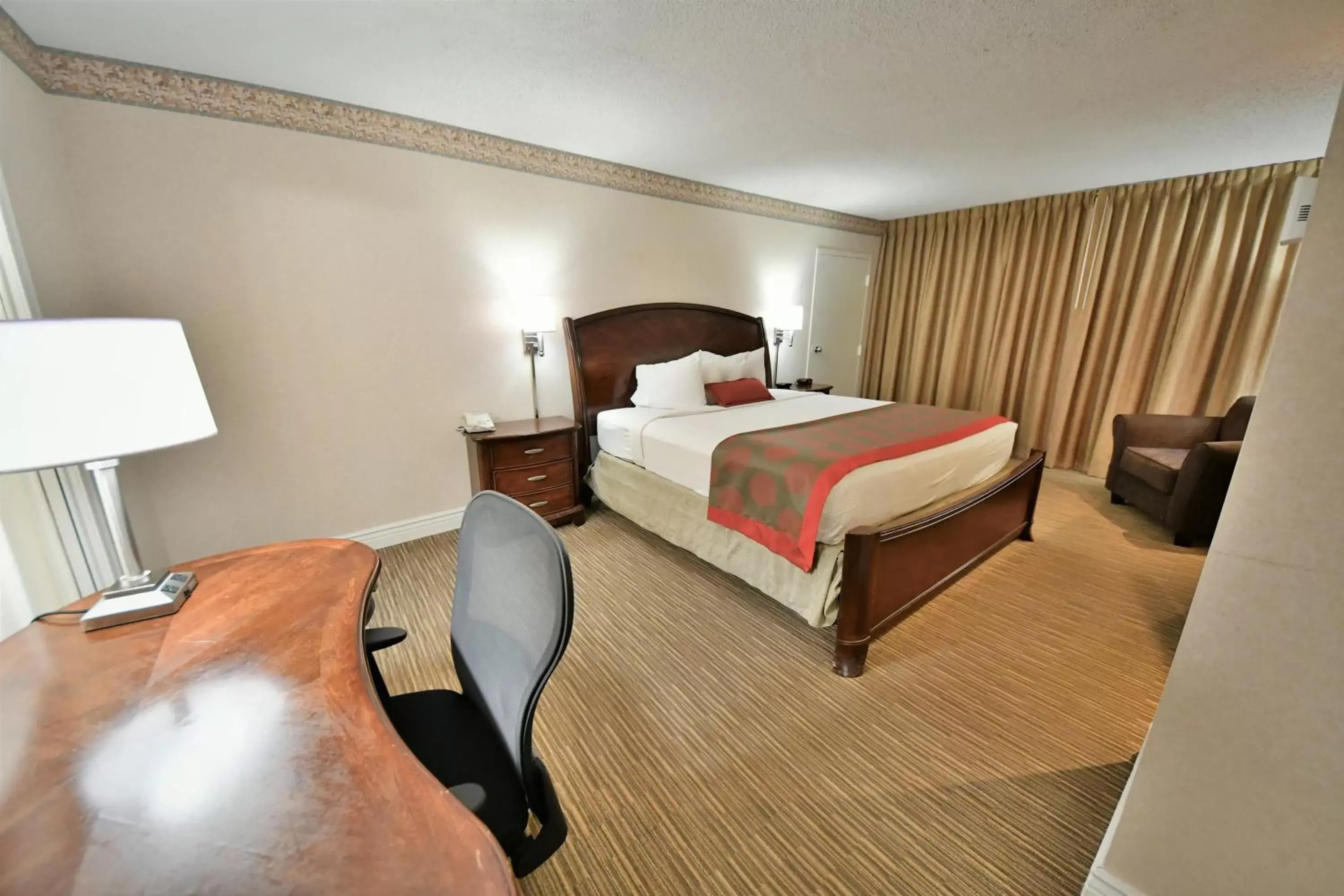 Bed in Ramada by Wyndham Jacksonville Hotel & Conference Center