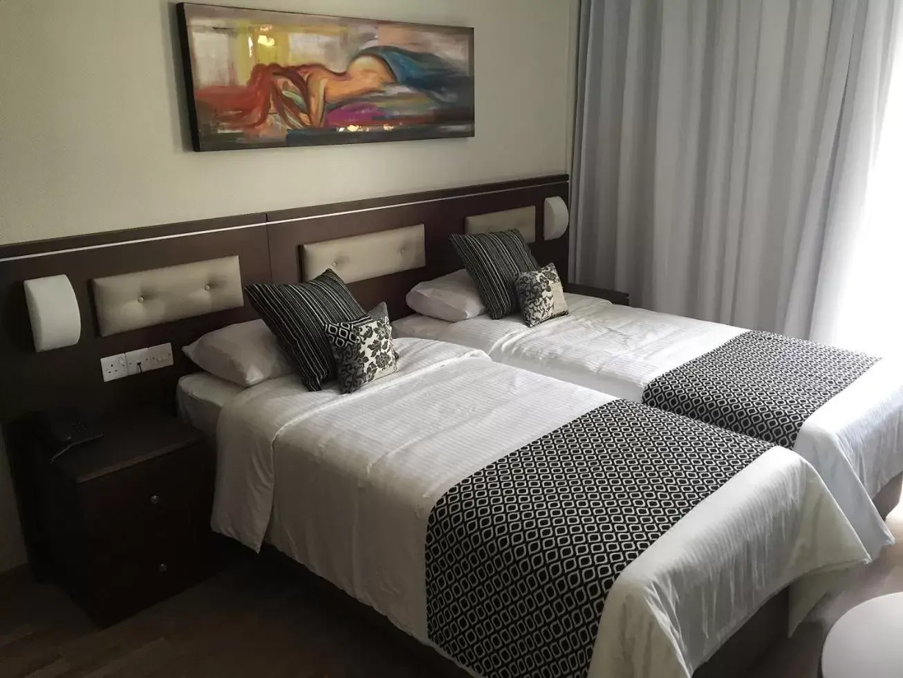 Bed in Livadhiotis City Hotel