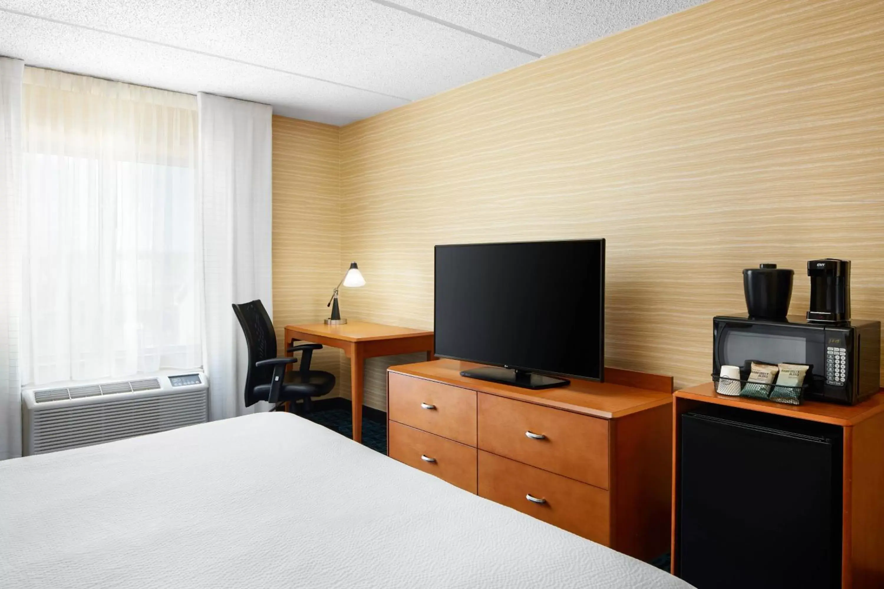 Photo of the whole room, TV/Entertainment Center in Fairfield Inn and Suites by Marriott Plainville