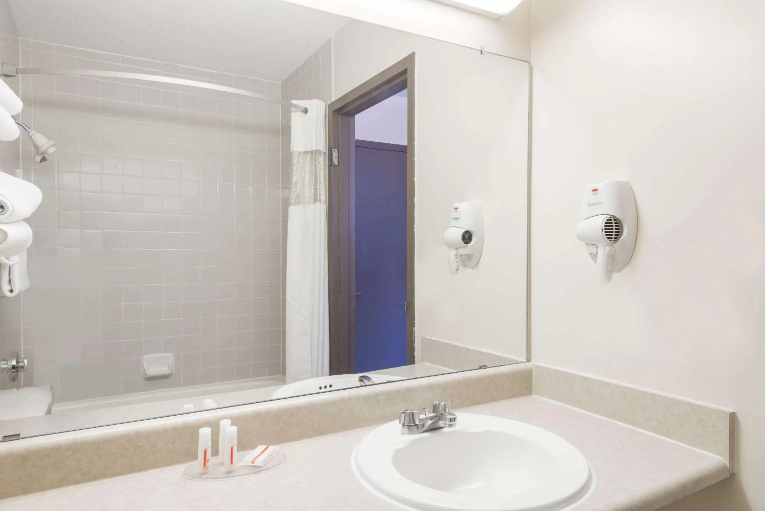 Bathroom in Ramada by Wyndham Watertown Thousand