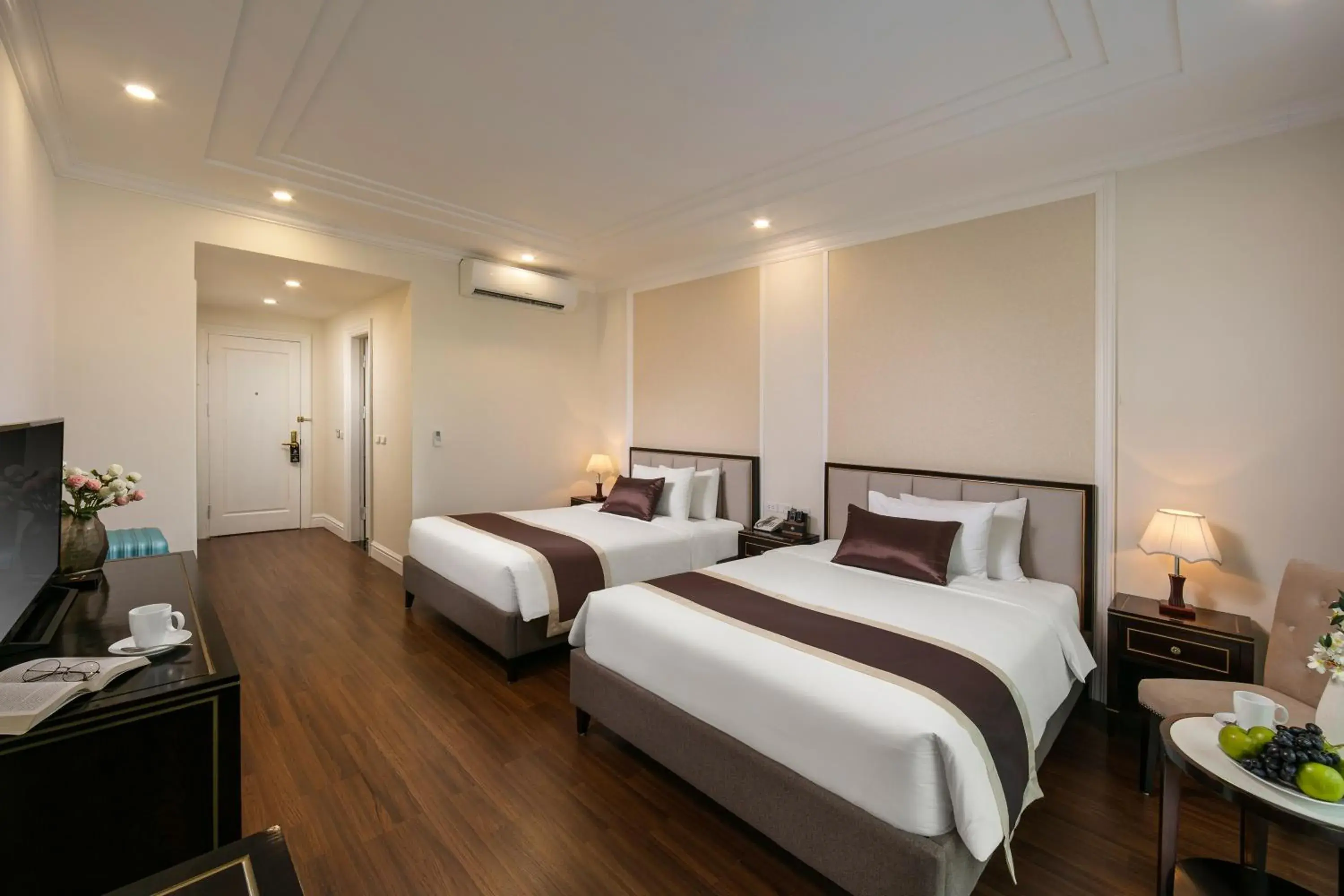 Bed in Adonis Hanoi Hotel