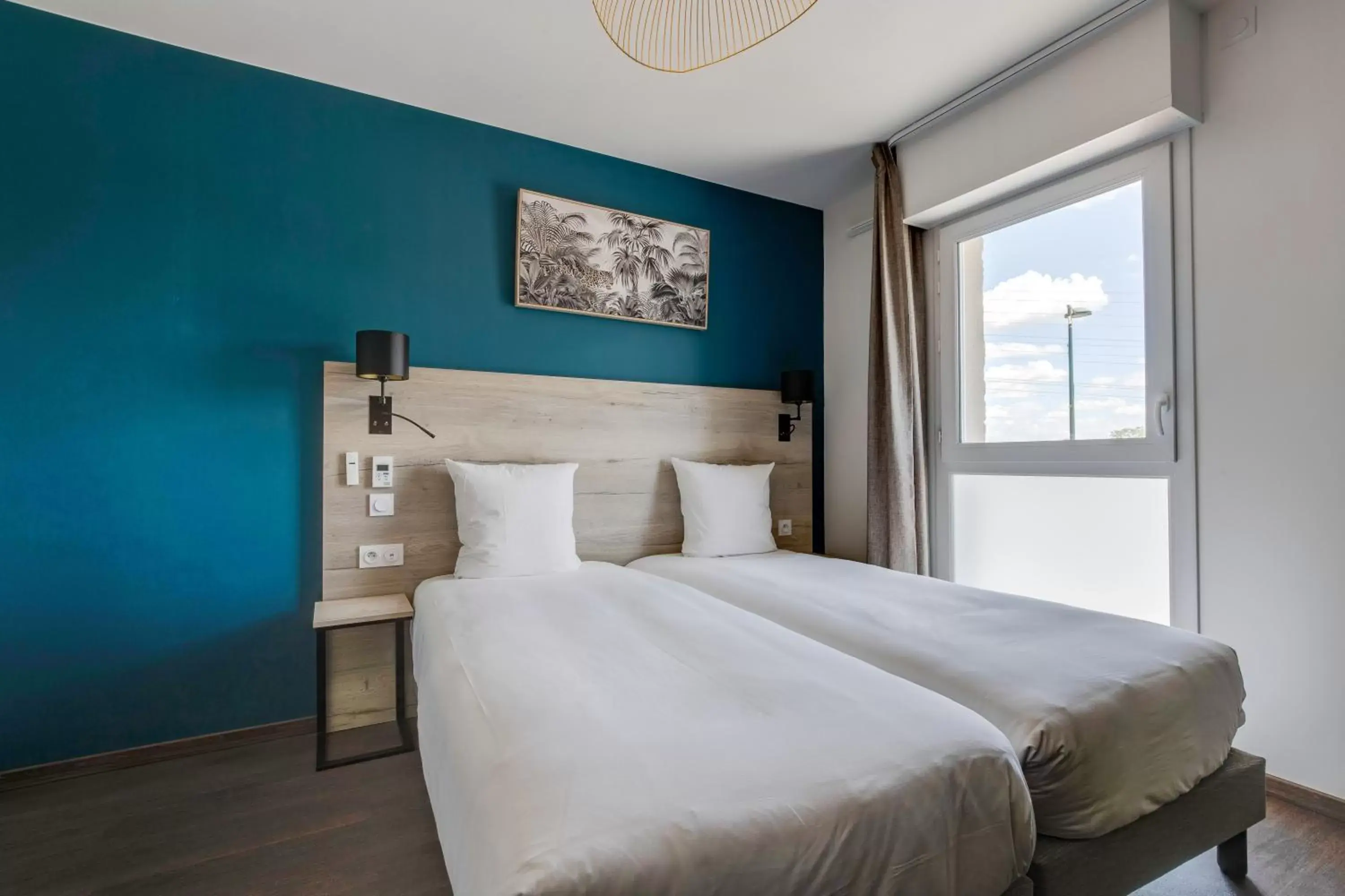 Bedroom, Bed in All Suites Appart Hôtel Massy Palaiseau