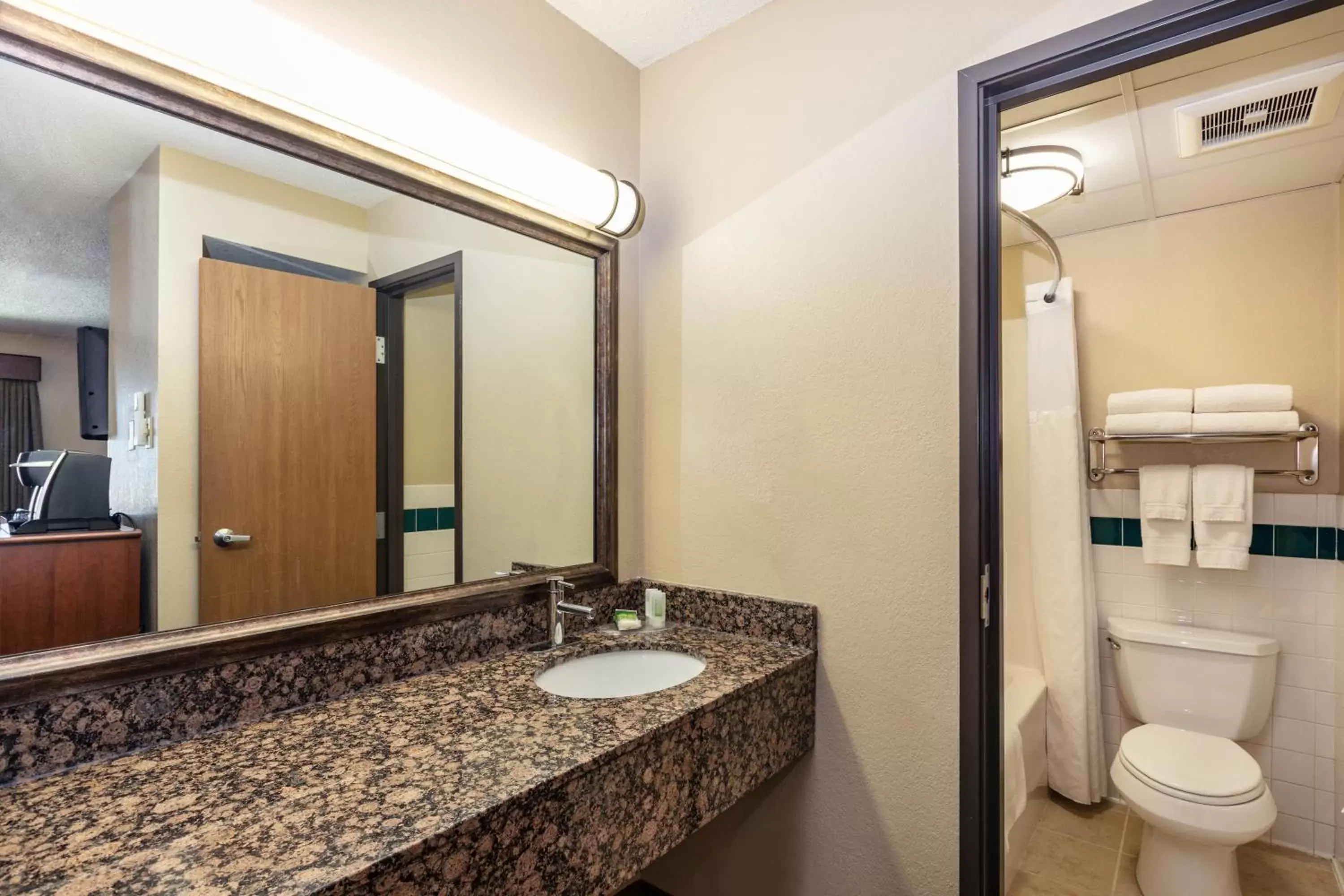 Bathroom in AmericInn by Wyndham Roseau