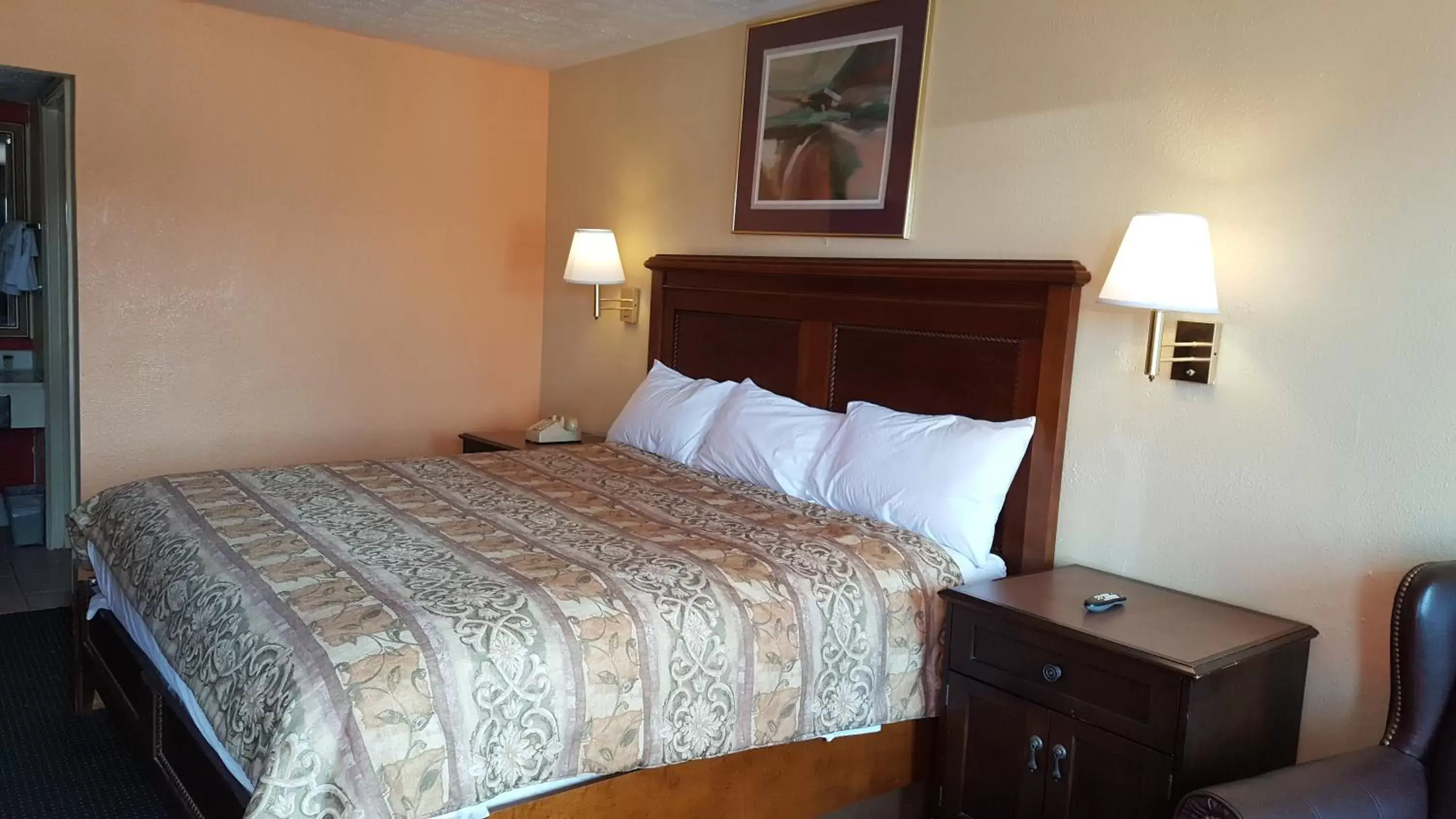 Bed in Garden Inn and Extended Stay