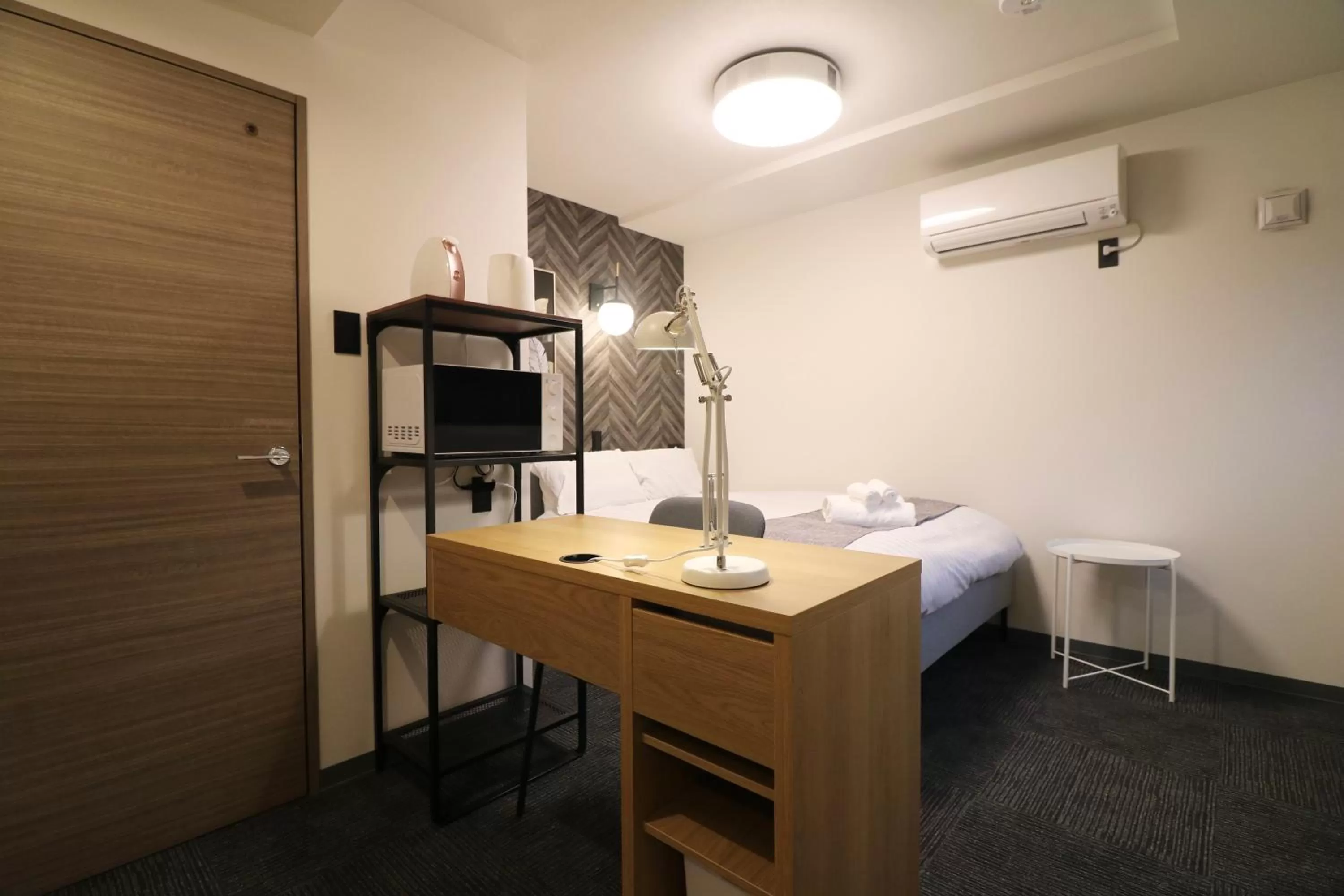 Bed in TAKETO STAY PREMIERE SAPPORO Eki