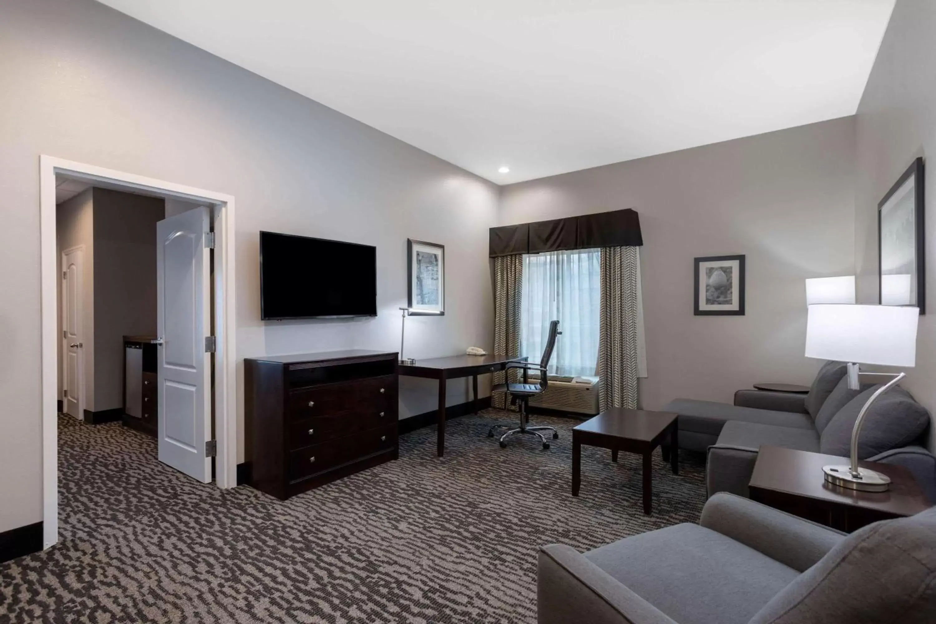 Photo of the whole room, TV/Entertainment Center in La Quinta by Wyndham Huntsville Airport Madison