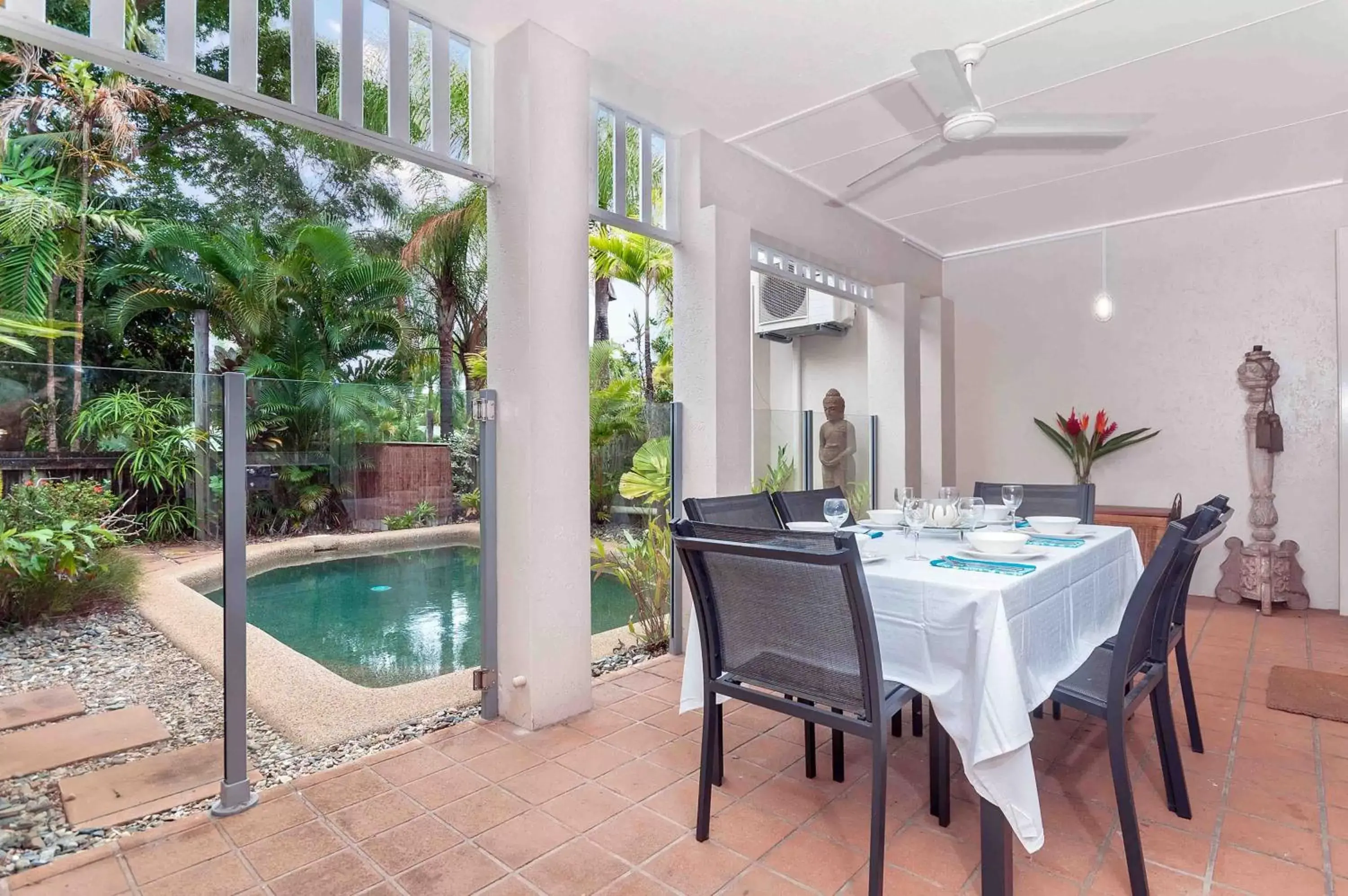 Dining area, Swimming Pool in The Villas Palm Cove