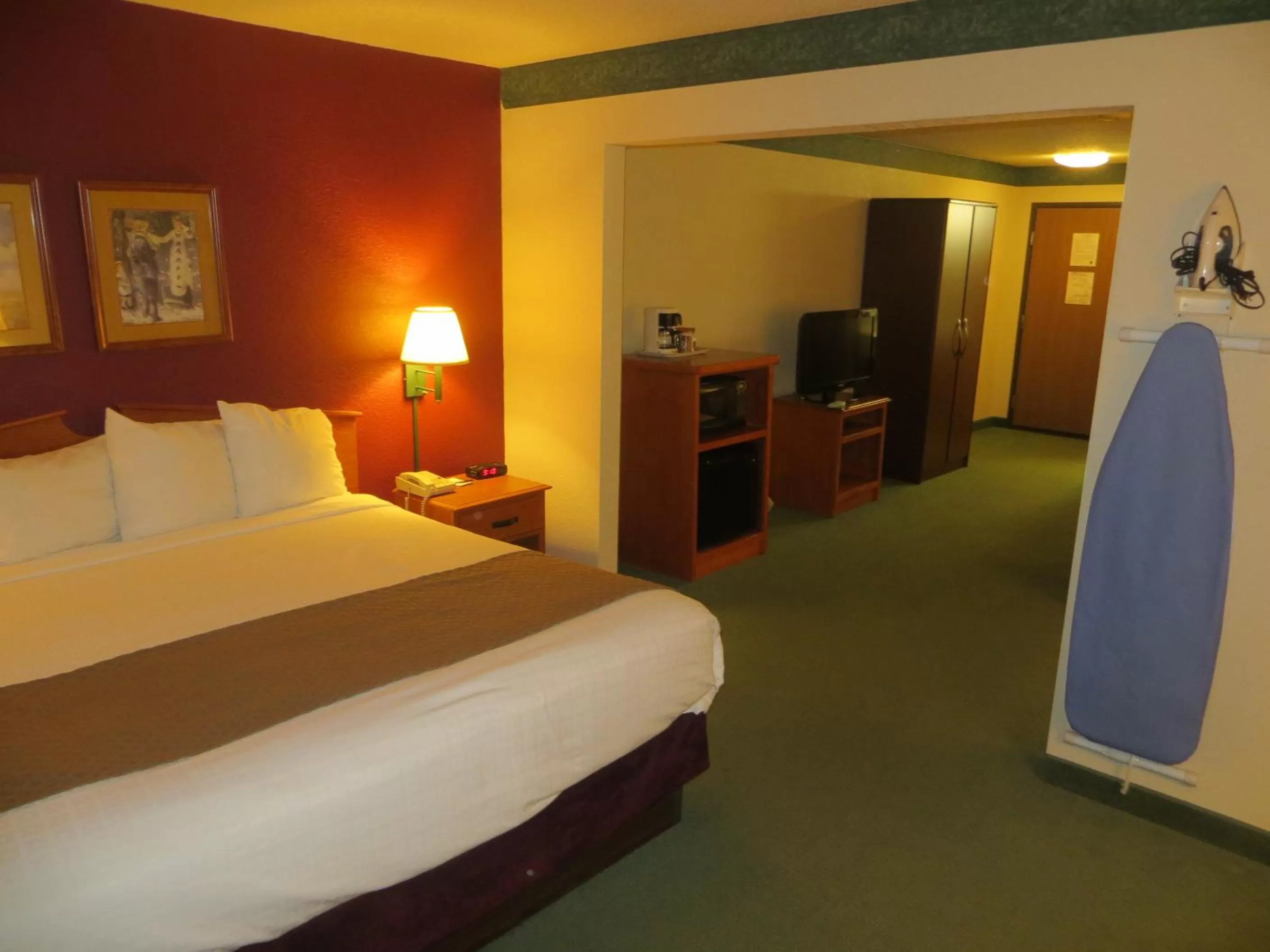 Bed in AmericInn by Wyndham Manitowoc