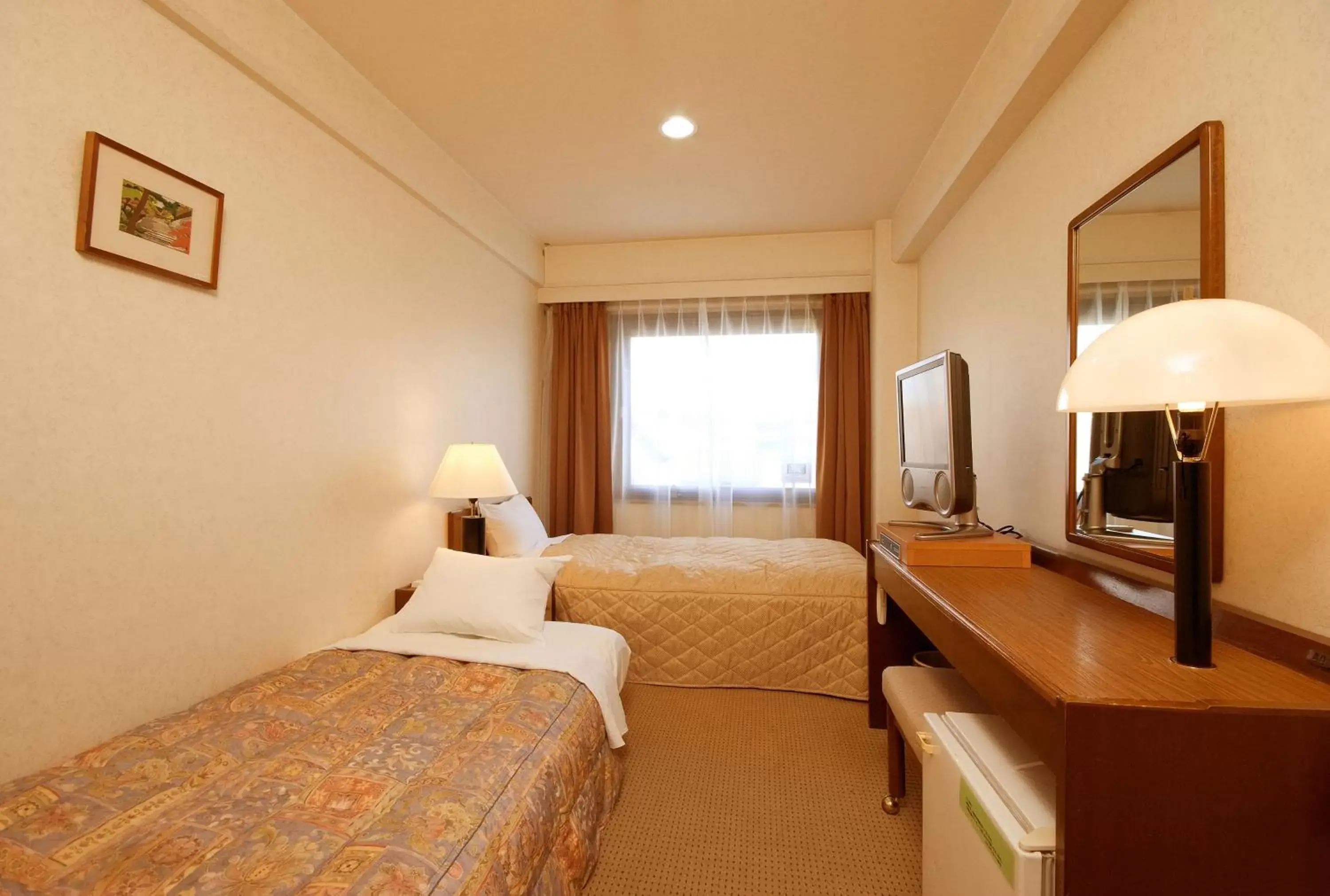 Bed in Hotel Sunroute Matsuyama