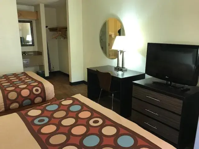 Bed, TV/Entertainment Center in Super 8 by Wyndham Fayetteville