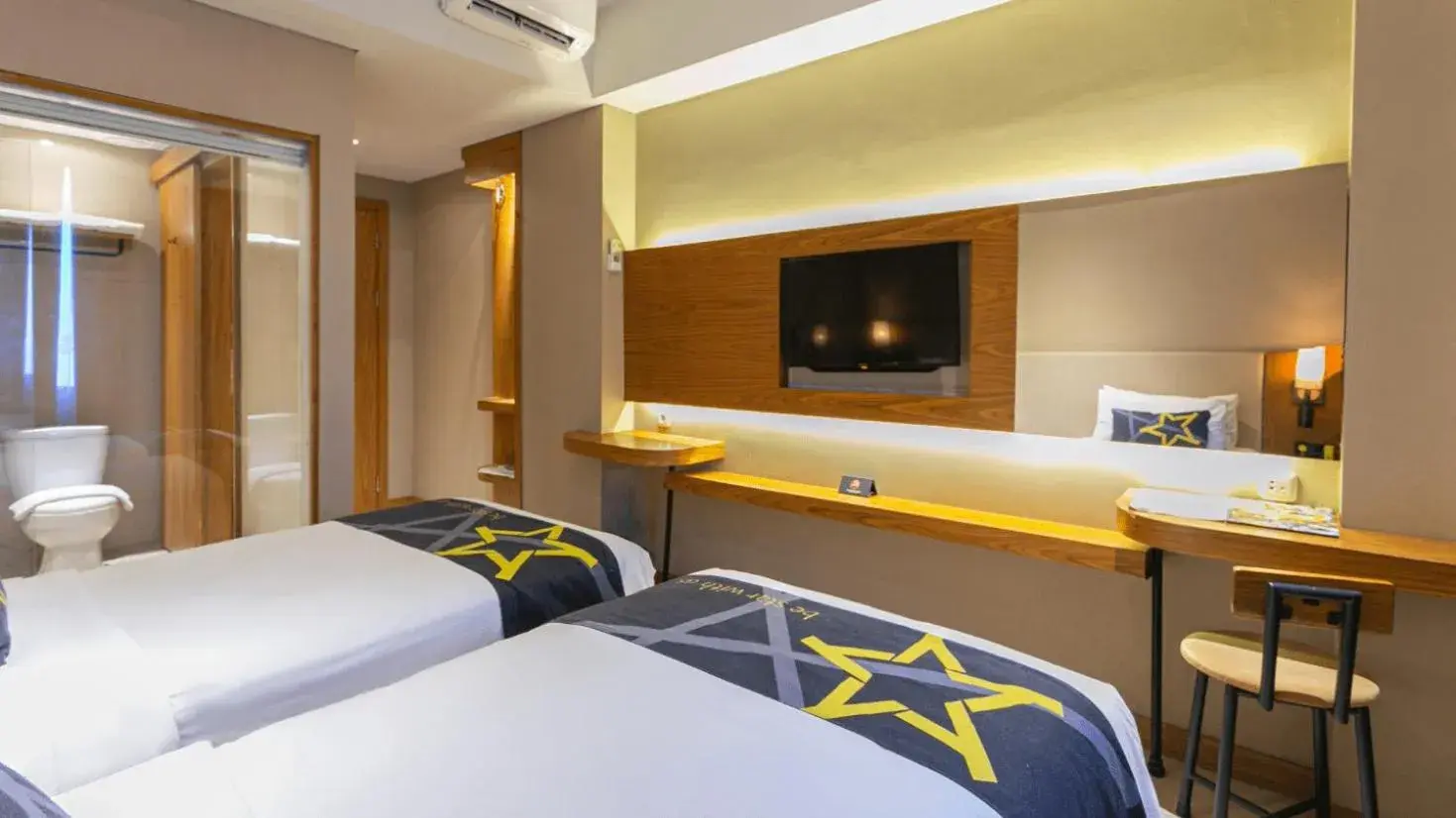 Bed in Yellow Star Ambarukmo Hotel