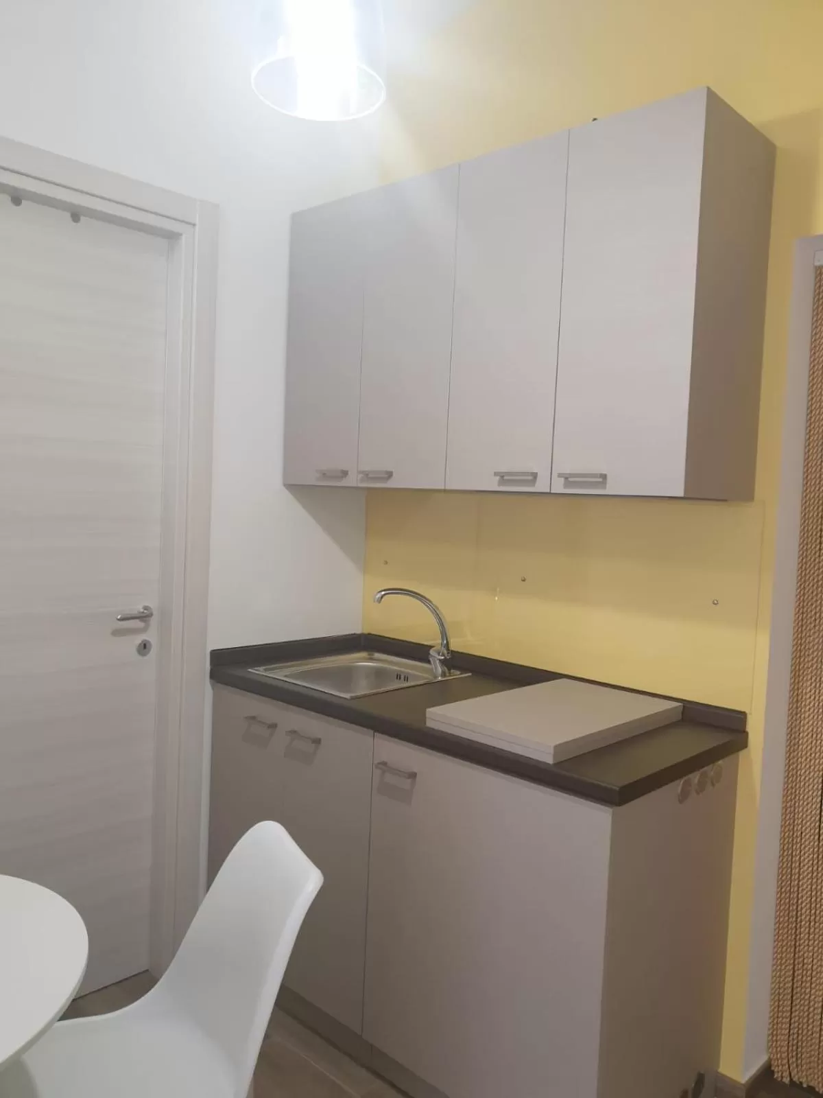 Kitchen or kitchenette in Comeacasa B&B