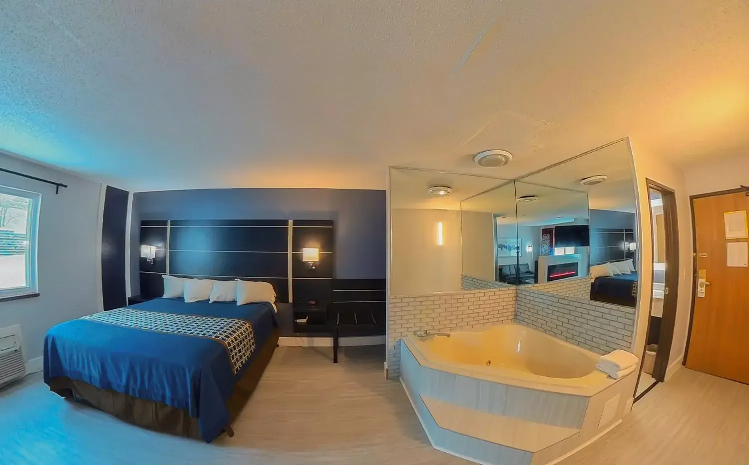 Bed in Coratel Inn & Suites by Jasper Hastings