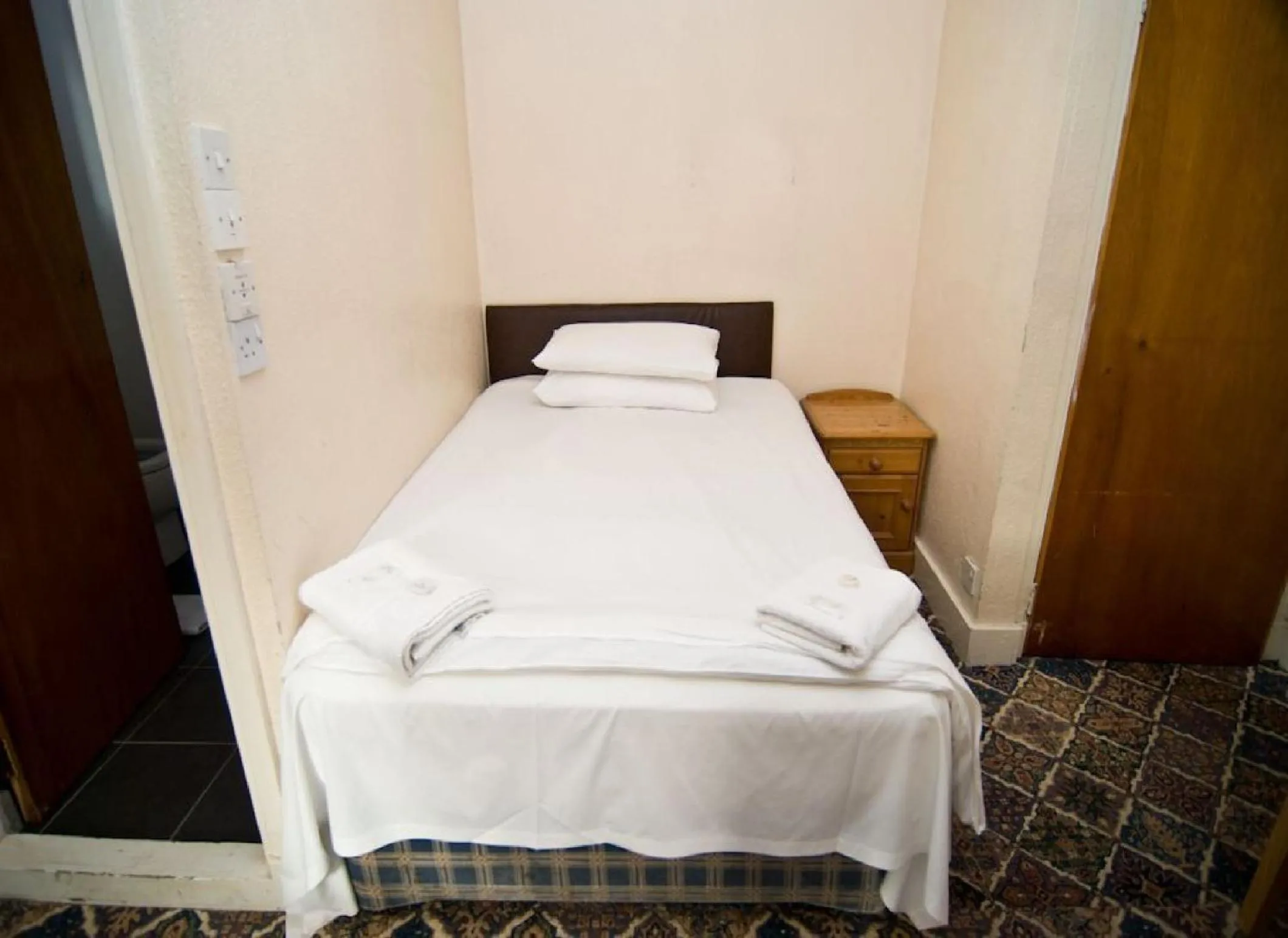 Bed in Charlie Hotel