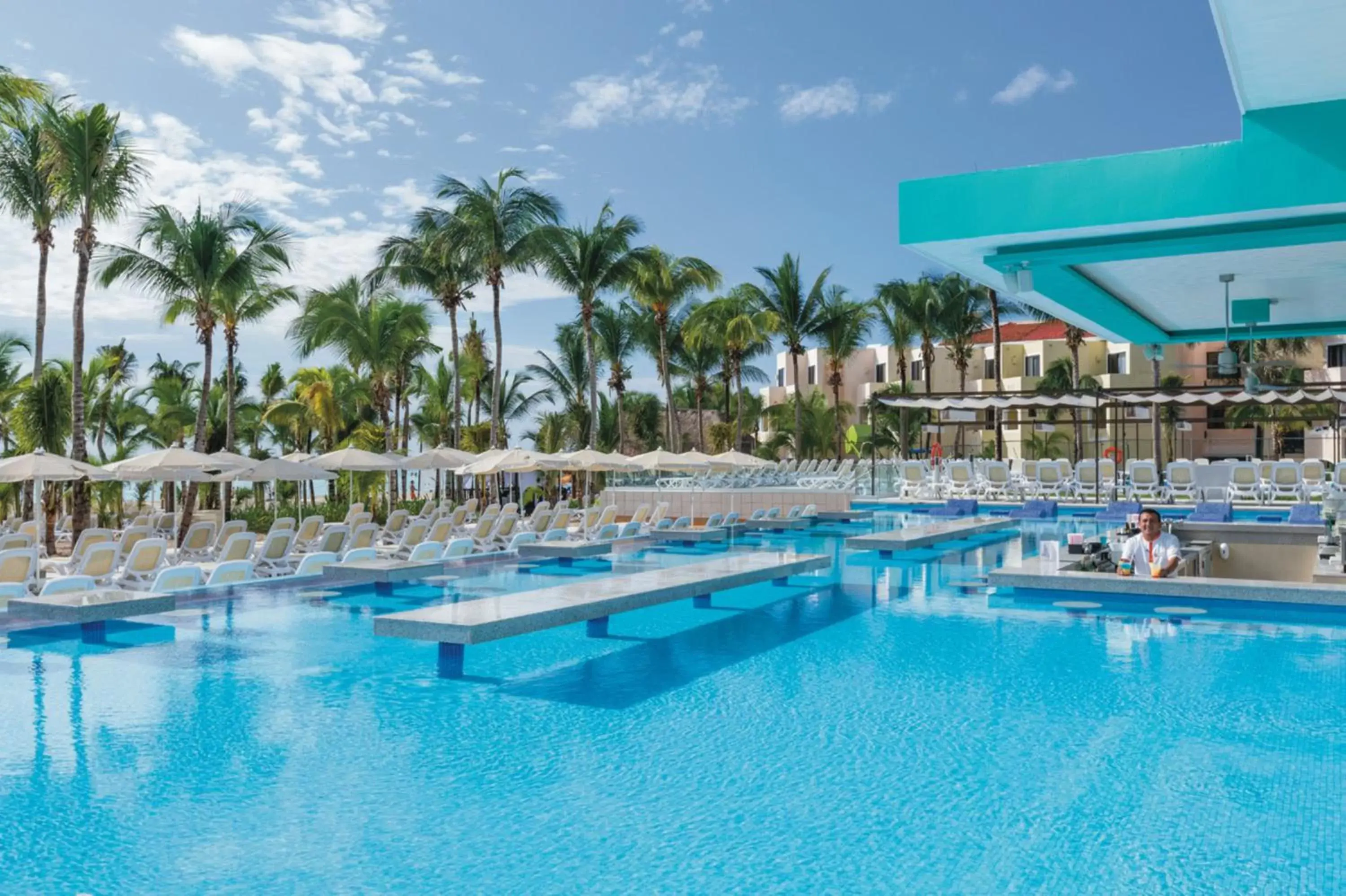 Swimming pool in Riu Playacar - All Inclusive Swimming pool in Riu Playacar - All Inclusive