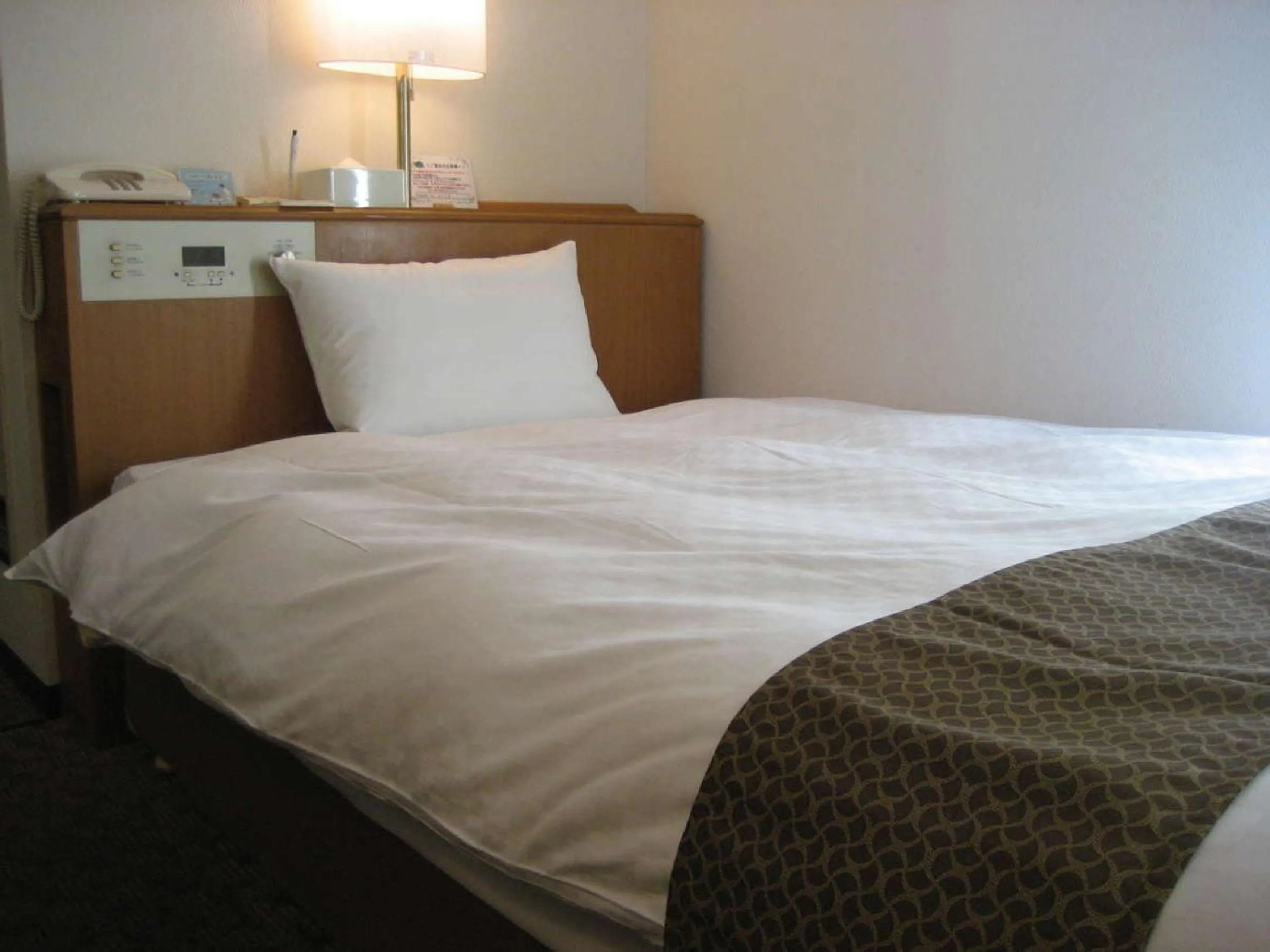 Photo of the whole room, Bed in Matsumoto Tourist Hotel