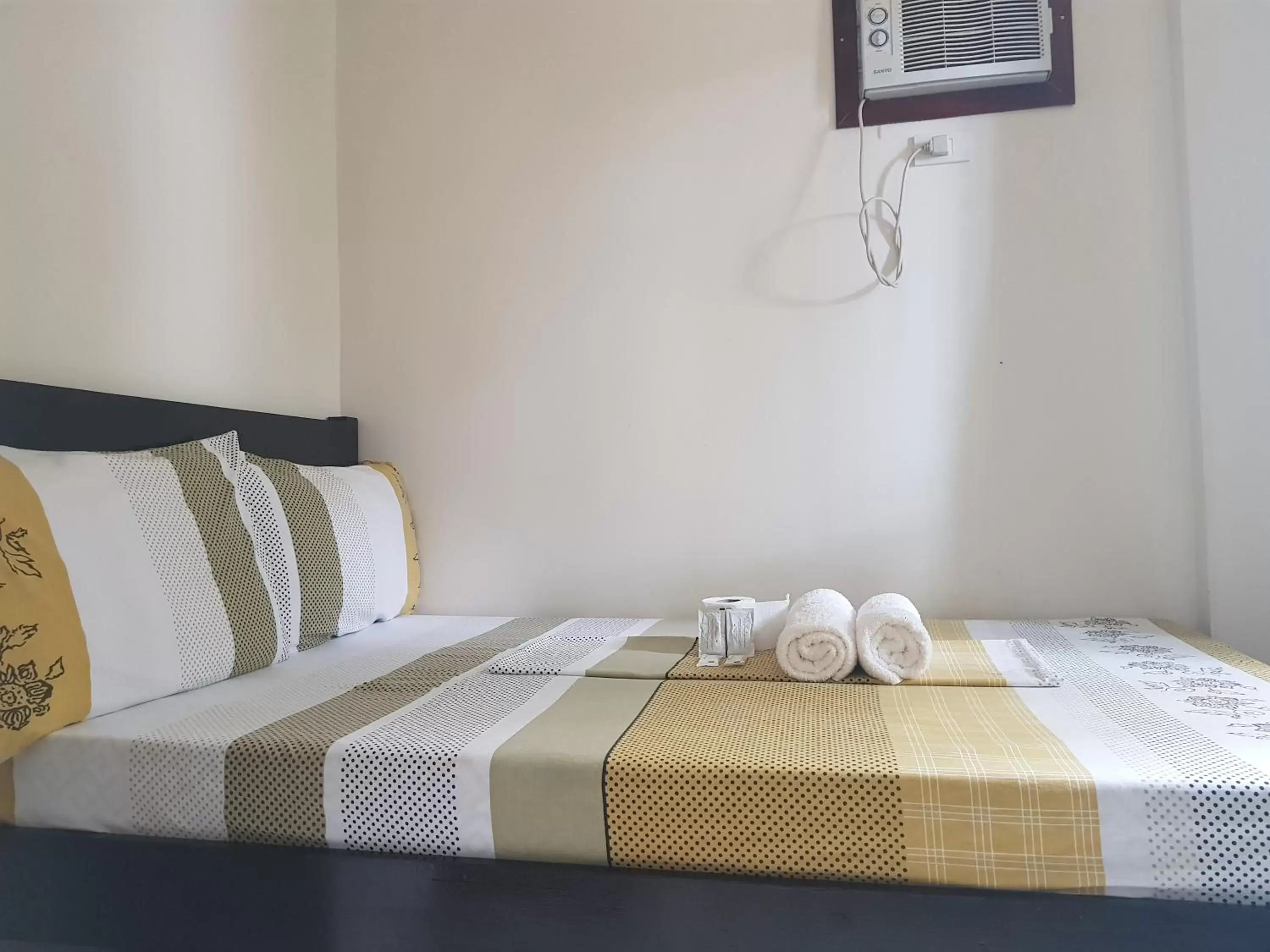 Bed in Inngo Tourist Inn
