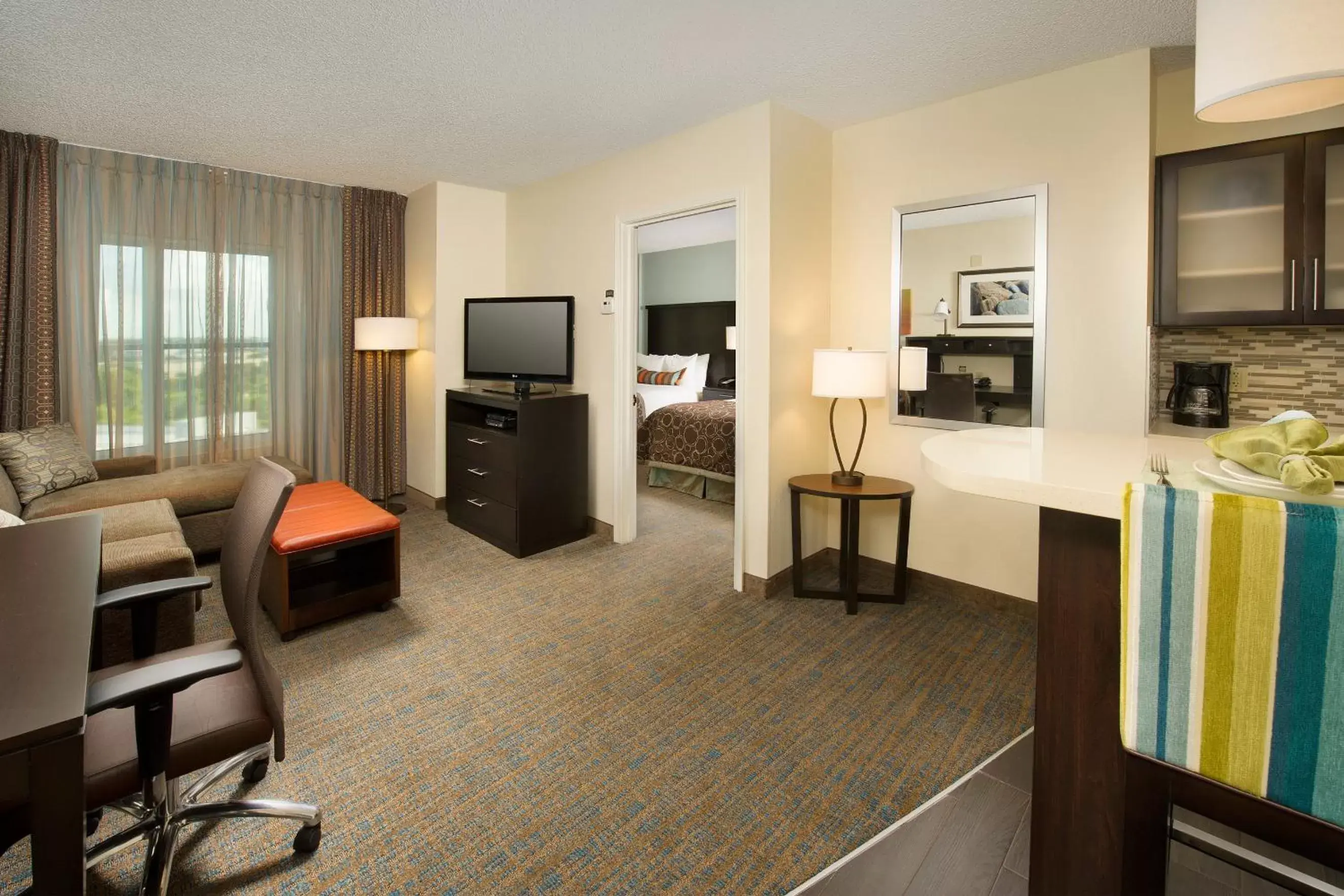 Kitchen/Kitchenette in Staybridge Suites Houston East - Baytown, an IHG Hotel