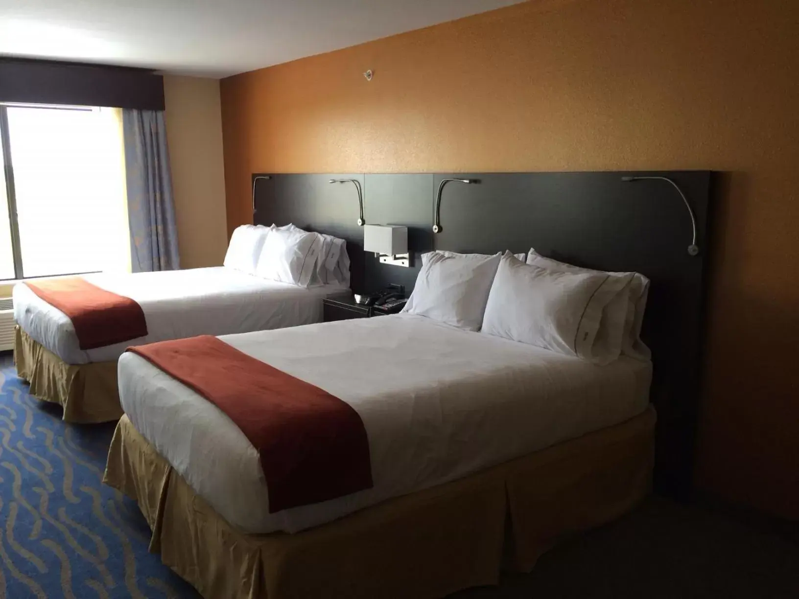Bed in Holiday Inn Express & Suites St Louis Airport, an IHG Hotel