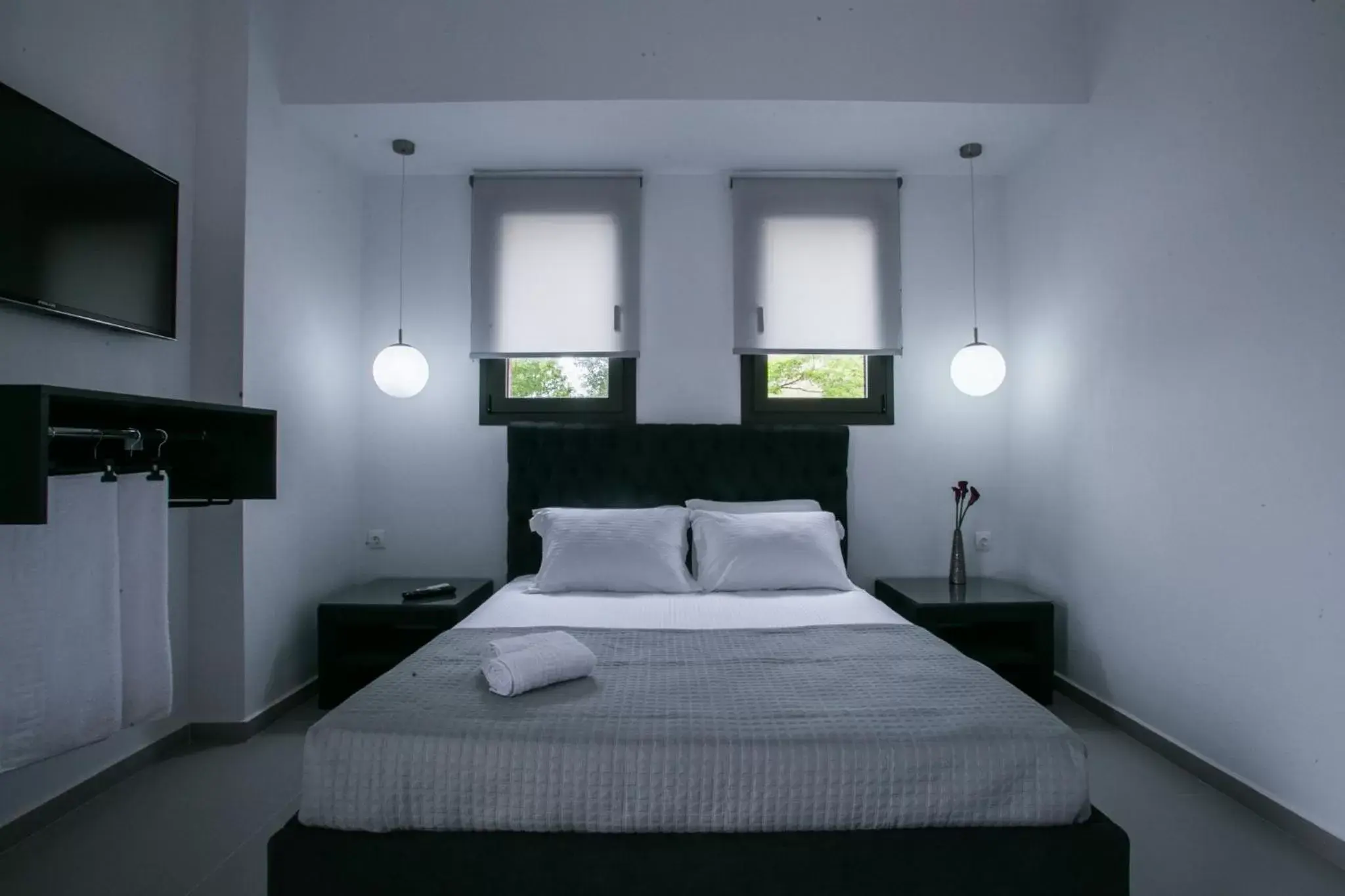 Bed in Anemos Luxury Apartments