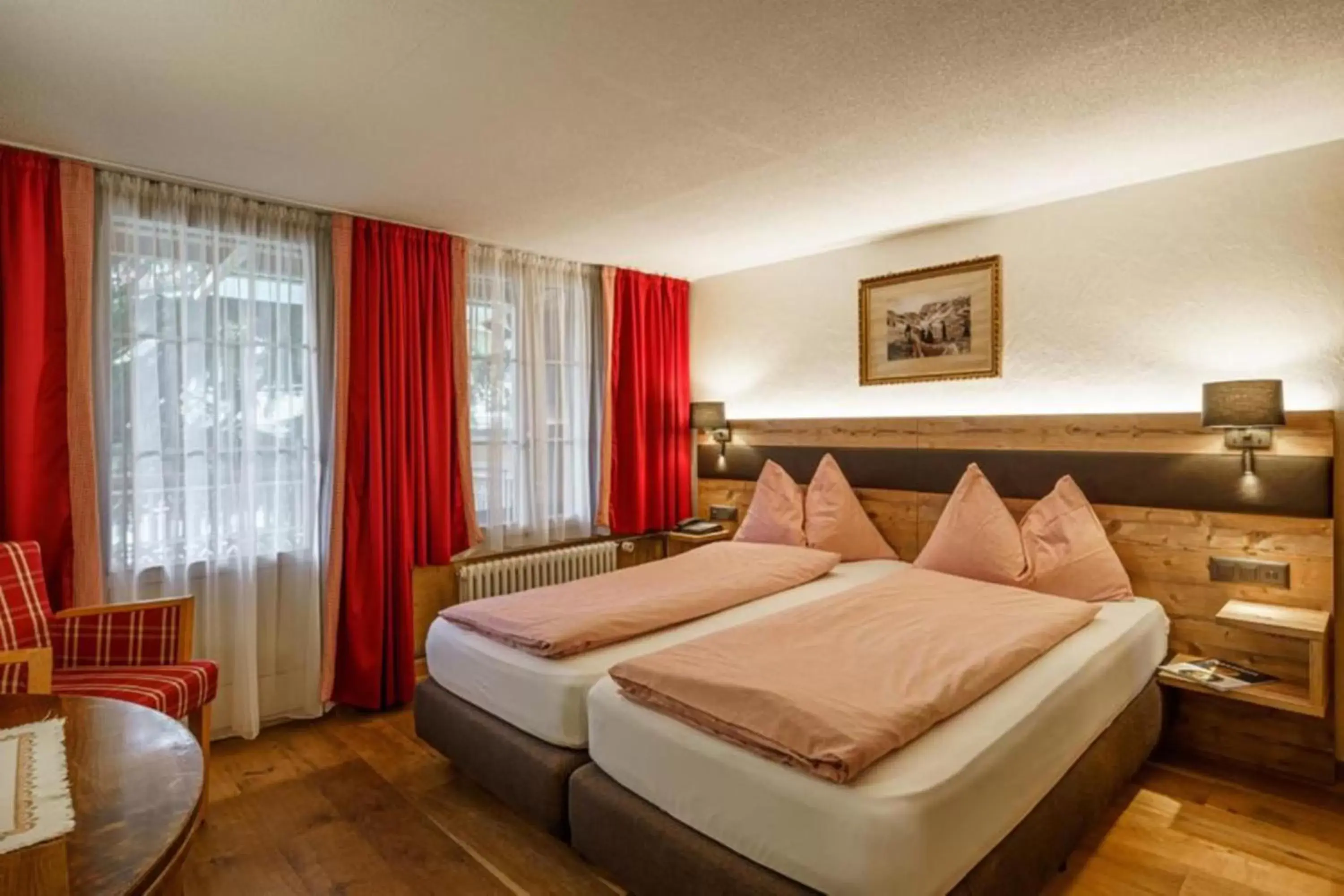 Photo of the whole room, Bed in Alpenblick Hotel & Restaurant Wilderswil by Interlaken