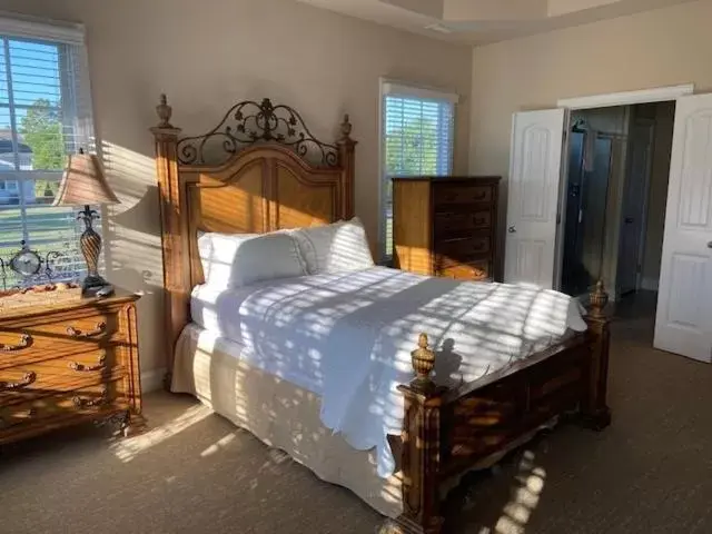 Bed in Cottages and Suites at River Landing